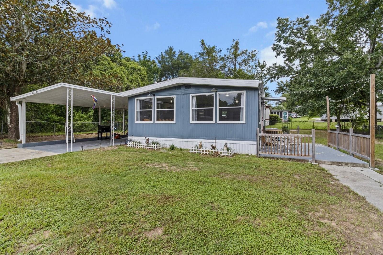 Tucked away at the end of Larkwood Ct, butting up next to the Withlacoochee State Forest, this cozy 2-bedroom, 2-bathroom home offers the perfect blend of peaceful living and modern comfort. You’ll enjoy a tranquil setting surrounded by nature—yet you’re only minutes from town for shopping, dining, and daily conveniences. Inside, you’ll find fresh paint and new luxury vinyl plank flooring, giving the home a clean, modern look with low-maintenance appeal. The open floor plan is great for entertaining & family gatherings, with a custom butcher block eat in countertop. The spacious master suite has barn doors leading to the newly remodeled en-suite bathroom. Enjoy the outdoors from the concrete patio on the right side of the home, or get some shade under the 40x12 covered carport & porch. A 15x12 finished laundry/utility room provides plenty of room for additional storage. Roof/2024, AC/2023, New Drainfield/2025. Whether you’re looking for a forever home or a quiet retreat, this gem combines comfort, space, and location—with the Withlacoochee trails and forest adventures just around the corner. You’ll find everything you need within easy reach. Shopping centers including Walmart, Lowes & TjMaxx are 5 minutes away and it's less than a 10 minute drive to HCA hospital and many other surrounding medical facilities. Call today to schedule your showing and start making new memories here!