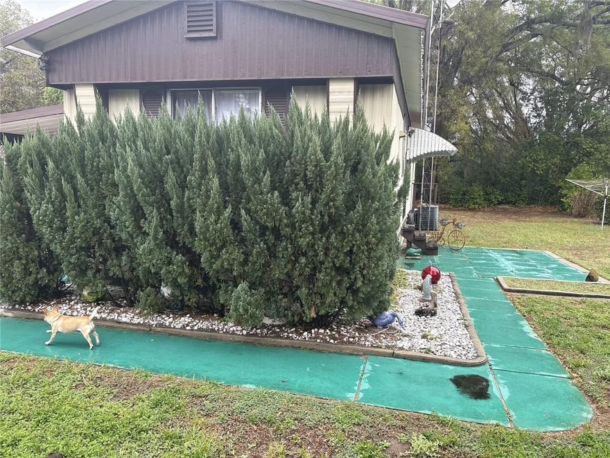 Beautifully Maintained Turnkey Home With Vintage 50s–60s Character on Owned Land
This charming, well-kept home is decorated with a nostalgic 50s–60s flair and is being offered fully furnished and turnkey. Everything remains with the property except the seller’s computer equipment, making this an easy move-in opportunity—just bring your clothes and toothbrush.
Located only minutes from The Villages®, shopping, dining, and everyday conveniences, this home offers comfort, character, and convenience. The seller is ready for a quick transition.
Interior Features
•  Additional enclosed room ideal as a den, hobby room, or enclosed lanai, providing extra living space.
•  Indoor laundry area with washer and dryer included (washer is newer).
•  Fully equipped kitchen with newer refrigerator, stove, microwave, and dishwasher, plus an eat-in dining area and updated flooring.
•  Turnkey furnishings throughout, maintaining the home’s delightful retro style.
Exterior & Storage
•  Large outbuilding divided into four separate sections, offering exceptional storage or workspace flexibility.
•  Attached carport with an additional workshop area, perfect for tools, hobbies, or seasonal storage.
This is a unique opportunity to own a fully furnished, move-in-ready home with abundant storage and vintage charm—all on its own land.
Must provide Proof of funds prior to showing. AGENTS Seller will not except offers on AS IS Contracts CASH ONLY