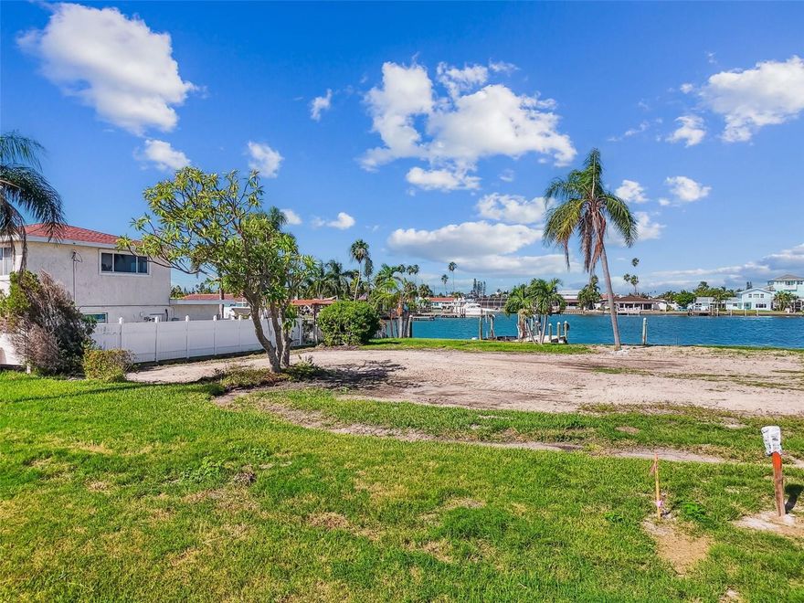 This large 3,146 HSF Home was impacted by the storm, which provides several attractive options for the new owner.  This home sits on a double-wide 140ft x 115ft lot with a newer 2022 Seawall.  The dock (2022) was also strategically left to one lot providing a potential for two buildable lots on this wide bay.  You overlook across a 500ft bay with views and opening to the main Intracoastal.  This allows for safe harborage along with easy access to all the waters including a short 10-minute ride to Johns Pass and the Gulf of Mexico.  The swimming Pool is in place with a wide-open lot to enjoy sunsets and share good times with friends and family.  The main house includes 4 bedrooms, two large living areas, inside utility and laundry and an attractive foyer entry and large screen porch.  A large 3-car garage (30 x 22) offers rollup doors to the back as well as front for easy access to toys and tools.  Whether your choice is to build two large executive waterfront homes or enjoy and oversized estate home, this is one location you should certainly consider as your next beach home.  All of this is located in the unique limited-access Crystal Islands subdivision in the heart of Tampa Bay's best beaches.  Giving you easy access to the mainland of Pinellas to enjoy downtown St Petersburg's museum, entertainment, and arts districts.  It is an easy ride to Tampa International Airport and the many sports and theme park amenities available throughout Tampa Bay.