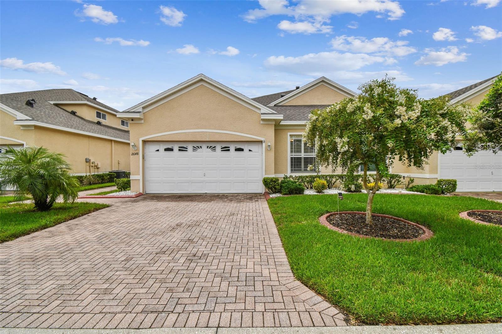Welcome to this beautifully maintained 2-bedroom, 2-bathroom home offering nearly 1,400 sq. ft. of thoughtfully designed living space. Step inside to discover an open layout featuring tall ceilings, updated flooring, and elegant plantation shutters on every window. The spacious kitchen and dedicated laundry room add everyday convenience, while the versatile floor plan provides plenty of comfort and functionality.
Relax and unwind on the screened porch or extended patio with peaceful pond views—perfect for entertaining or enjoying Florida’s natural beauty. This home offers peace of mind with a newer A/C system, water heater, and water softener already in place. A 2-car garage provides ample parking and storage, and the low HOA fee includes access to a sparkling community pool for year-round enjoyment.
Located in a desirable neighborhood close to shopping, dining, and Gulf Coast beaches, this property combines comfort, value, and convenience. Don’t miss the opportunity to make this charming home yours! (ROOF-2021, covered by HOA)(A/C-2025)(W/H-2024)(WATER SOFTENER-2024)