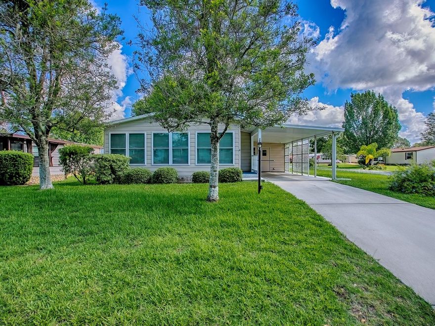 Reduced! Owner motivated, back on the market. Freshly painted, no wall paper.  Welcome to The Villages at The Village of Silver Lake! This 2-bedroom, 2-bath home offers formal living with separate dining room. An additional site-built sunroom runs across the full width of the home, creating a bright and welcoming space. The kitchen has Kraftmaid wood cabinetry and a solar tube to bring in the daylight.   Skylights are in both bathrooms.  Entire house is in luxury vinyl flooring, with the exception of the master bedroom, which has new berber carpet installed in 2023. Brand new roof in 2023, brand new HVAC in 2024, newer water heater.  The primary suite includes a private en-suite. The second bedroom is just across the hall from the second bathroom.  Additional features include an oversized golf cart garage with LG stacked front-loader washer and dryer, and ample space for a workshop. This is affordable Florida living in this golf course community, just minutes from shopping, dining, medical, and more. This property provides easy access to the Shay gate, is right across the highway from Spanish Springs Town Square, and is a short golf cart ride to Lake Sumter Landing Town Square. The property is only blocks away from the Silver Lake Golf Course, and is within a short golf cart ride to four other nearby golf courses. The house comes with a 13-month Home Warranty at no cost to the buyer.