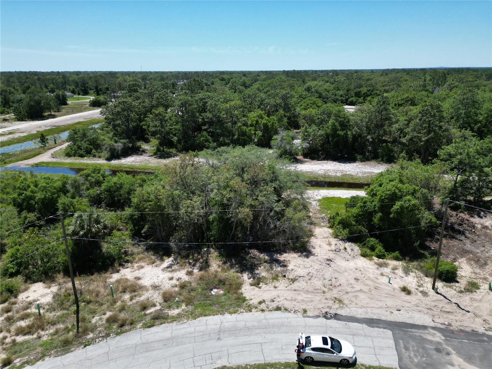 Build your dream home on this vacant lot located on Caribbean Ct (Lot 8) in the established community of Poinciana, FL 34759. Surrounded by completed homes, this lot offers a great opportunity to create your ideal living space in a stable and friendly neighborhood. The current HOA fee for the vacant lot is $25.54 per month, which increases to $85 per month after building a home and includes internet and cable services. Optional amenities are available for an additional fee and include pools, a fitness center, basketball courts, gymnastics, and more—please contact the HOA for full details. This prime location offers convenient access to shopping and entertainment including Poinciana Towne Center (3.9 miles), The Promenade at Cypress Pkwy (3.8 miles), Fun Spot America Kissimmee (2.4 miles), Castaway Cove Adventure Park (4.7 miles), and Old Town (7.8 miles). With easy highway access, commuting and exploring Central Florida is a breeze. All information is deemed reliable but should be independently verified; please conduct your own due diligence.