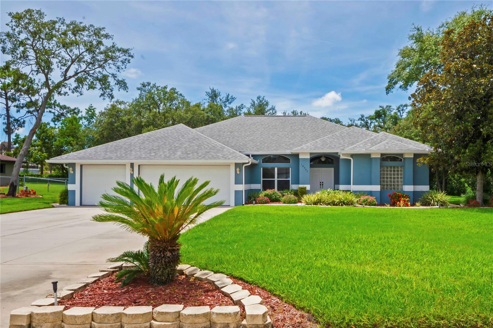 Welcome to Autumn Oaks – Where Privacy, Space & Nature Meet Elegance....
If you’re searching for privacy, generous space, unique character, and the natural beauty of Florida, look no further than the sought-after Autumn Oaks community. Nestled on a serene ½-acre homesite, this custom-built, one-owner pool home offers 4 bedrooms, 3 full bathrooms, and 2,847 sq. ft. of living space designed for both comfort and entertaining.
Step inside through the formal entryway to find a spacious formal living and dining room, ideal for hosting. The heart of the home is the open-concept kitchen, complete with white cabinetry, a built-in pantry, Corian countertops, and an island with breakfast bar. A charming breakfast nook features a stunning fishbowl window, offering panoramic views of the sparkling solar-heated pool and lush backyard.
The adjoining family room features vaulted ceilings and triple glass sliders that seamlessly bring the outdoors in, creating a bright and airy gathering space.
The private master suite is a peaceful retreat with its own sitting area, two walk-in closets, and direct pool access. The luxurious en-suite bath offers dual vanities, a large spa tub, separate shower, linen closet, and a private water closet. Bedrooms 2 and 3 share a full hall bathroom, while Bedroom 4 is situated near a third bathroom—conveniently with pool access. All bathrooms include double sinks for added functionality.
The oversized screened-in lanai is perfect for entertaining, featuring: Two covered seating areas, Outdoor grill with extensive cabinetry, Exterior storage closet, Ceiling fans, Brick pavers and architectural columns, fenced backyard dog run, Additional highlights include: Inside laundry room with sink, washer, and dryer, 3-car garage with ample storage, Roof replaced in 2017, Water heater approx. 2021
Located in the scenic Autumn Oaks subdivision where each home sits on at least half an acre, this community offers low HOA fees and a wide array of amenities: tennis, pickleball, bocce and basketball courts, playground, picnic and grilling areas, restrooms, and community sidewalks with street lighting.
Conveniently situated on the Pasco/Hernando County line, you’ll enjoy quick access to US 19, the Suncoast Parkway, major shopping centers, restaurants, Tampa and Tampa International Airport.