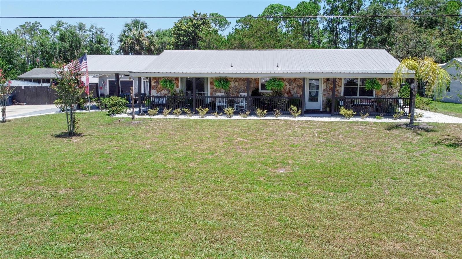 Welcome to 702 N Chapel Dr, this incredible Ranch style property is one of a kind! Have you been searching for a beautifully renovated home that checks all the boxes? Beautifully designed bedrooms, spacious bathrooms, gorgeous kitchen with its own private bar, several outdoor sitting areas, private in-law suite and a place to park your boat and RV?!? I'm pleased to announce that 702 N Chapel Dr checks all those boxes. This charming one-of-a-kind home offers 1,987 sq ft of thoughtfully designed living space, 3- bedrooms and 2 bathrooms in the main portion of the house plus a private in-law suite with a private bedroom, full bathroom, living and kitchenette area (total of 325 sq ft.) From the moment you arrive, the charm is undeniable. A full-length front porch invites you in, while a long driveway, 3-car carport, detached 1-car garage and an additional fenced in area with a carport provide ample parking and storage for car lovers, RVs, or a boat. As you waltz through the kitchen you'll notice the beautiful bamboo flooring, stainless steel appliances, private bar area and beautiful view of your front yard. Directly off the kitchen awaits your primary suite. Spacious, bright and beautiful with a large walk-in closet, massive bathroom, dual vanity sinks and a huge tile shower. As your flow back through the kitchen the large laundry room is to your left and is an access point into the in-law suite. Gorgeous cypress shiplap soar from the floor to the ceiling in your cozy, spacious living area. The second bedroom is spacious and bright, with the secondary restroom directly next door. The 3rd bedroom in the main, is currently used as an office and is the second access point to get in the in-law suite from the main home. As you step inside the in-law suite, you'll be greeted with a dual functional living and kitchen space with a microwave, refrigerator and cook top! To the rear of space, your private bedroom and full-sized bathroom awaits. This in-law suite has two private entrances to the exterior of the home and its own private fenced in back yard! Enjoy multiple outdoor sitting areas, a thoughtfully landscaped yard and endless possibilities for entertaining or relaxing in style. Schedule your private showing today to truly immerse yourself in this incredible space. Major systems – including the roof, HVAC, and water heater – are just 7 years old (per seller).