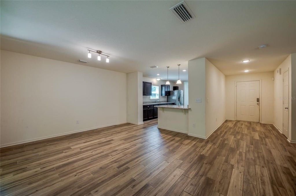 Photo of 421 Champion Ridge Drive, Daytona Beach, FL 32124 (MLS # V4951572)