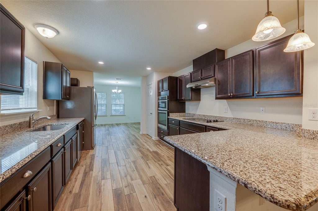 Photo of 421 Champion Ridge Drive, Daytona Beach, FL 32124 (MLS # V4951572)