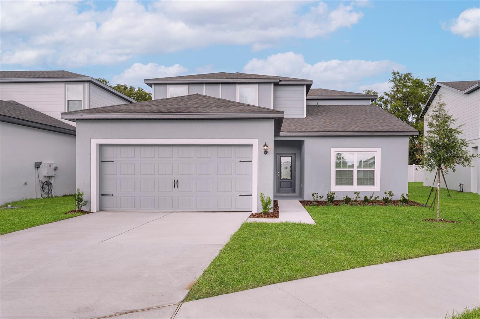 Under Construction. Reduce Price! Private Corner-Lot! Welcome to the Parc model in the vibrant Tula Parc community of Astatula, FL! This spacious two-story retreat offers 4 generously sized bedrooms and 2.5 bathrooms, all designed with comfort and functionality in mind. Every bedroom features its own walk-in closet, offering abundant storage throughout the home.
The open-concept layout creates a seamless flow between the kitchen, dining area, and living room, perfect for entertaining and everyday living. The chef-inspired kitchen is loaded with upgrades, including brand-new Whirlpool® appliances, granite countertops, a large closet pantry, and 36” upper wood cabinets with crown molding. Additional features include Moen® faucets, LED flush-mount Energy Star® lighting, and a programmable thermostat.
The private master retreat is a relaxing sanctuary with a spacious en-suite bathroom featuring dual sinks and a walk-in closet. Designer touches throughout the home include coach lighting, double-pane Low-E vinyl windows, and a Wi-Fi-enabled garage door opener.
Sitting on a corner lot, this home also showcases mature landscaping and plenty of natural light. As part of the Tula Parc community, residents enjoy access to a community gazebo and playground, and are just minutes from the Chain of Lakes and Little Lake Harris, offering endless options for boating, kayaking, and fishing.
This Parc model is truly a perfect blend of style, space, and location—schedule your tour today!
