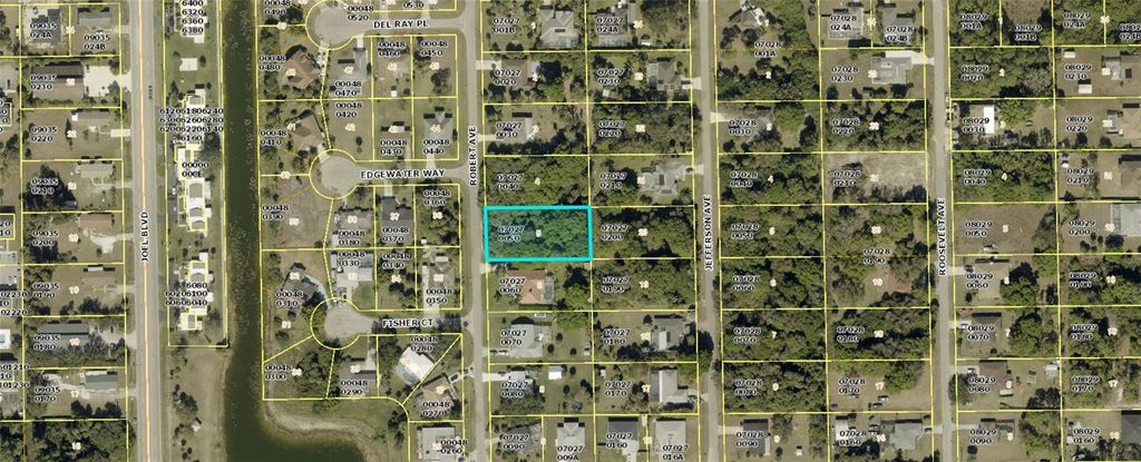 Photo of 614 Robert Avenue, Lehigh Acres, FL 33936 (MLS # OM727564)