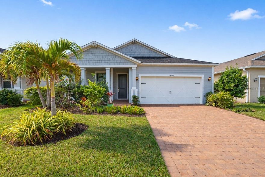 Located in the sought after gated community of Avaunce in Lakewood Ranch where residents enjoy low HOA fees and no CDD fees. This beautifully upgraded 4 bedroom 3 bathroom home offers 2,340 square feet of thoughtfully designed living space. Upon arrival, you are greeted by a beautifully kept exterior with a wide paver driveway, lush landscaping, and a welcoming front porch that sets the tone for the elevated finishes found inside. Step into a bright, custom-designed interior that feels like a model home with luxury vinyl flooring, custom painting, upgraded lighting, and thoughtful woodwork throughout. The open living room is anchored by a stunning custom built-in entertainment center that instantly elevates the space while offering both beauty and function. Large windows frame peaceful water views and fill the room with natural light, creating a relaxing atmosphere whether you're hosting guests or enjoying a quiet night in. The kitchen features rich cabinetry, quartz counters, a beautiful tile backsplash, updated fixtures, and an oversized island perfect for gathering. A walk-in pantry with custom shelving adds convenient storage. The adjoining dining area blends seamlessly with the main living space, keeping everything connected. The owner’s suite is a retreat of its own with tray ceilings, custom woodwork, a spa-like bathroom, and a dream closet outfitted by Closets by Design. Wake up to gorgeous water views and enjoy the peace of a truly private space. At the front of the home, an additional bedroom with en suite bathroom offers a second primary suite option that is ideal for multigenerational living, guests, or a private office suite. Two additional bedrooms and a full bathroom are positioned thoughtfully for privacy and convenience. Custom closet systems continue throughout the home, making organization effortless. Step outside to the screened-in back porch with over almost 640 sq ft of outdoor living. Brick pavers, custom lighting, a mounted TV, and a private hot tub create a resort-style atmosphere that overlooks the sparkling lake. This is the perfect setting for morning coffee, sunset cocktails, or weekend gatherings. Additional upgrades include a water filtration system, epoxy flooring in the garage, custom fans throughout the home, and impeccable attention to detail in every room. Avaunce is a gated community offering a pool, outdoor kitchen area, and activity center. Everyday conveniences are just minutes away with major grocery stores, shopping, and restaurants nearby. For lifestyle and entertainment, you are close to UTC Mall, Waterside Place, and endless dining and cultural experiences. Florida’s world-famous beaches are only a short drive away, and the home is zoned for A+ rated schools. Enjoy the convenience of being only eight houses away from the community pool. Even better, there are no CDD fees for added value and peace of mind. This home brings together luxury, comfort, and a beautifully designed floor plan in one of Lakewood Ranch’s most desirable gated communities.