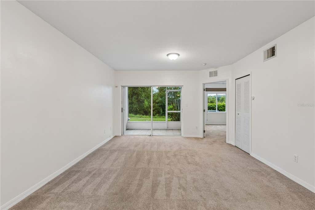 Photo of 522 Villa Del Sol Circle #101, Orlando, FL 32824 (MLS # O6433606)