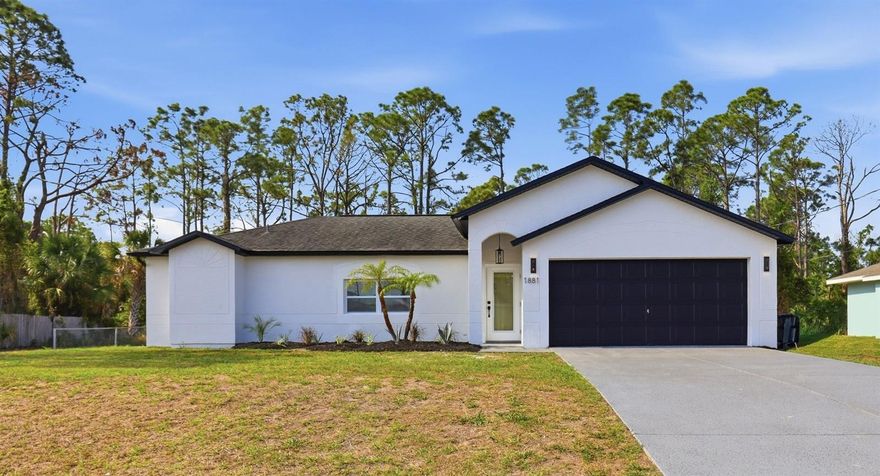 Welcome home to this beautifully renovated 3-bedroom, 2-bath home ON CITY WATER *** in North Port! This move-in ready home blends modern upgrades with warm, homey vibes throughout—and with no HOA, you’ll enjoy added flexibility and freedom. Not located in a flood zone, you can also have peace of mind along with a ton of updates. Step inside to find fresh paint, sleek tile flooring, recessed lighting, and updated fixtures that create a bright, inviting space. The kitchen is a standout with quartz countertops, stainless steel appliances, extra cabinetry with soft-close features, and even a built-in wine refrigerator—perfect for entertaining or unwinding at the end of the day. Both bathrooms have been fully renovated, featuring floor-to-ceiling tiled showers and anti-fog LED mirrors for a clean, modern feel. The primary bedroom includes a custom closet designed for both function and style. Nearly all windows have been upgraded to new impact-resistant windows, adding both efficiency and peace of mind. Outside, you’ll love the refreshed landscaping and the epoxy-coated garage floor that adds a polished touch. With a 2019 roof and thoughtful upgrades throughout, this home truly checks all the boxes. Plus, you’re just a short drive to the beach—perfect for enjoying the Florida lifestyle year-round.