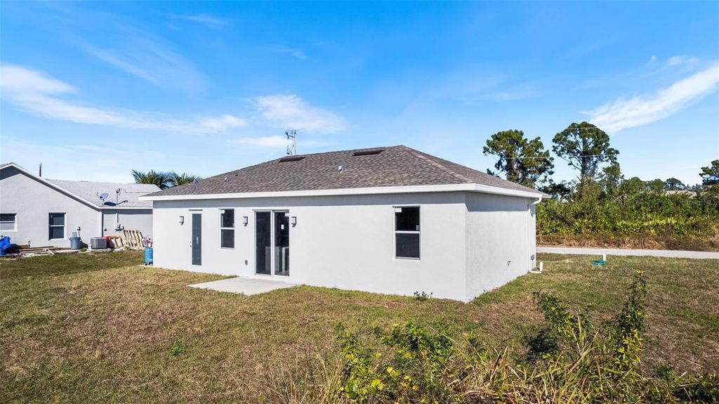 Photo of 1035 Barcelona Street E, Lehigh Acres, FL 33974 (MLS # TB8485031)