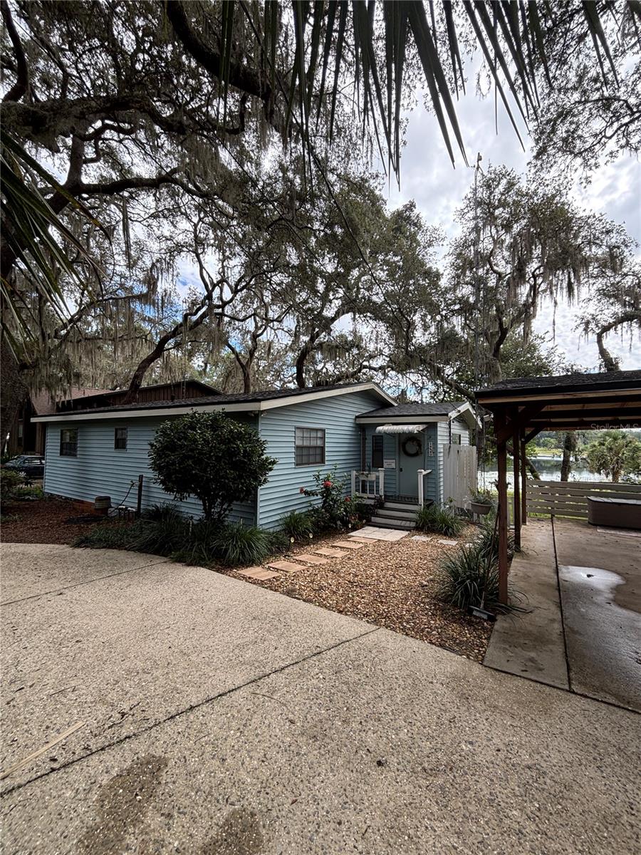 Come see this beautiful Lakefront 2/1 Frame Home on Spring-fed Crystal Lake!! Brand-new roof on the home and carport was just put on in July 2025! Perfect for a forever Lakefront home or an ideal investment Air-BnB/Vrbo property. Enjoy the nice paved street neighborhood leading to the roomy paved circular driveway along with a detached 11 x 17 one-car carport. Outside features a beautifully landscaped front entrance with pavers and rock walkway, gorgeous landscaped trees and plants/flowers, partially fenced, 7 x 10 vinyl shed, fire-pit, small open patio, all overlooking beautiful sunset views of Crystal Lake. Inside features a beautiful open kitchen with track lighting and a must-see kitchen bar with butcher block countertop (the seller has the other matching butcher block countertop for sink area in the laundry room, just needs to be installed), high ceilings throughout, massive living room, dining area, completely remodeled bathroom, inside laundry and front inside door entrance features newer beautiful cedar paneling, spacious 28 x 12 florida room overlooking Crystal Lake. Don’t Let the age fool you, this home has been updated per Seller with a brand-new roof in July 2025, all new flooring throughout in 2015, new butcher block kitchen counters in 2024, and new plumbing throughout in 2021. Completely remodeled bathroom from top to bottom with new plumbing, flooring, vanity, toilet, and shower in 2021! Make this home yours today!