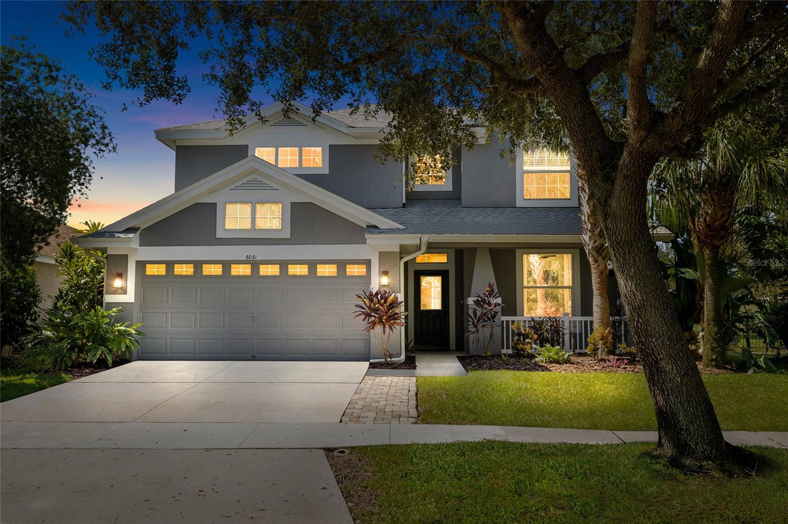YOUR DREAM HOME AWAITS! PRIVATE POOL & SPA! Located in the desirable FishHawk Ranch! This STUNNING home features 4 bedrooms, 2.5 bathrooms, and a 2- car garage. Upon arrival, the home has great curb-appeal with pavers along the driveway and a covered front porch. Step inside, into a grand foyer with HIGH CEILINGS AND WOOD-LOOK TILE THROUGHOUT, and a separately located DOWNSTAIRS PRIVATE OFFICE! Past the staircase, there is a formal dining room, which can easily be utilized as flex space if desired. The remodeled kitchen has many appealing features, including a CENTER ISLAND WITH GLASS PENDANT LIGHTS, GRANITE COUNTERTOPS, BACKSPLASH, MODERN STAINLESS-STEEL APPLIANCES WITH A GAS COOKTOP & BUILT-IN OVEN, FARMHOUSE SINK, AND A WALK-IN PANTRY! The kitchen overlooks the family room, which features a WOODBURNING FIREPLACE WITH CUSTOM SHELVING AND A SHIPLAP WALL! DOWNSTAIRS POOL BATH WITH SHIPLAP! Upstairs, you will find the well-sized bedrooms and full bathrooms. The Owner's suite has everything you could ever want, including TWO WALK-IN CLOSETS, BUILT-IN SHELVING, AND A REMODELED ENSUITE BATHROOM! The bathroom features a DOUBLE SINK VANITY WITH GRANITE COUNTERTOPS, GARDEN TUB, FULLY TILED WALK-IN SHOWER, FRAMELESS GLASS SHOWER DOOR, AND MORE! Step out back, into your own private oasis! FULLY SCREENED-IN LANAI AND PRIVATE POOL, along with the SPACIOUS FULLY FENCED YARD, with lush landscaping that has been well-maintained! ** New HVAC & Furnace with transferable warranties, Pool Pump replaced in 2022, Water Softener and Kitchen Reverse Osmosis System replaced since ownership, Freshly Painted Lanai which has been Re-screened, Freshly Painted Trim, and 2021 Roof** This home has so much to offer, while being in a wonderful community FILLED with scenic ponds and trails, resort style amenities, clubhouses, parks and playgrounds, and zoned for ALL A-rated schools! Don't wait! Call today to schedule a private viewing!