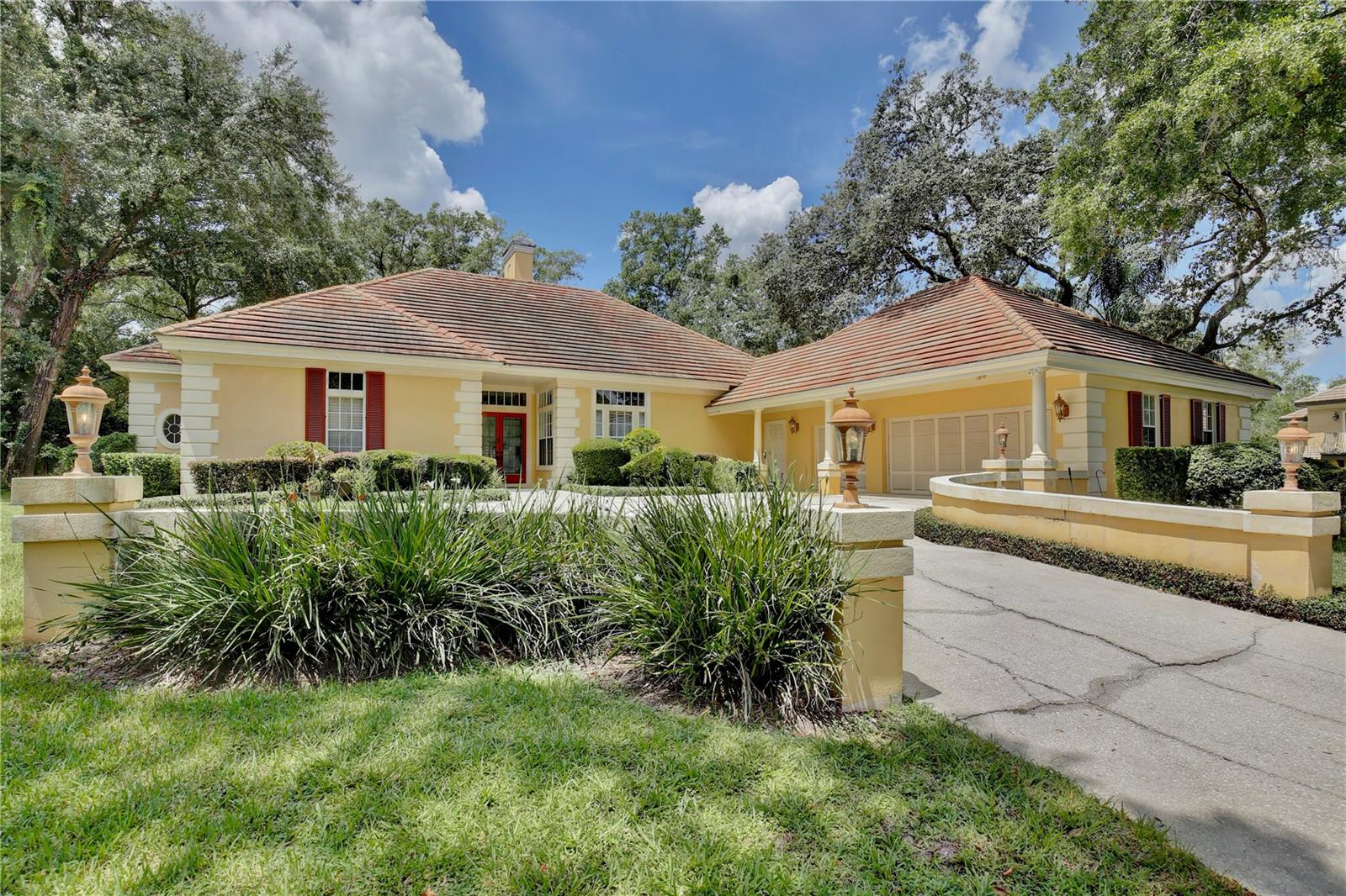 Discover your dream home within walking distance of Wekiva Springs, where tranquility and convenience seamlessly blend to offer an idyllic living experience. This captivating five bedroom, three bathroom abode boasts enviable curb appeal and resides on a peaceful cul-de-sac, ensuring a serene and private lifestyle. As you approach, the side entry three car garage and glass double doors invite you into a grand foyer, complete with a convenient coat/shoe closet. The foyer gracefully transitions into a living room crowned with soaring ceilings and a cozy fireplace, where natural light pours in through sliding glass doors offering stunning views of the pool. Entertain in style in the dining room, adorned with elegant columns, chair rail trim, crown molding, and a rustic chandelier. Across the living room, a family room features a fireplace and sliding glass doors leading to an impressive outdoor kitchen, perfect for al fresco dining. Both living areas are artistically divided by an accent wall with a double sided fireplace. Culinary enthusiasts will delight in the kitchen, showcasing generous cabinet storage, decorative backsplash, granite countertops, stainless steel appliances, built in double ovens, and bar top seating with beadboard wainscoting. A custom nook above the sink and a coffee/drink station add to the kitchen's charm. The giant primary suite, with pool views and a walk in closet, conceals a hidden storage safe room behind a bookshelf with a secret swinging door. Its en suite bathroom is a spa like retreat, offering dual vanities, a garden tub, and a luxurious glass door shower with a rainfall shower head and sprayer. A vast bonus room presents a wood plank ceilings and access to the outdoor deck. One guest bedroom with an en suite bath, and two more guest bedrooms across from the pool bath, ensure ample space for all. The laundry room enhances practicality with a washer, dryer, sink, cabinet storage, and closet space, The beautiful outdoor living area wows with its screened in lagoon style pool, shaded patio with vaulted ceilings and skylights, becoming your private oasis complete with a full summer kitchen. This stunning property promises an unparalleled lifestyle where luxury and relaxation meet. Just steps away from Wekiva Springs, you’ll have access to the community park which offers a kayak ramp and access to Wekiva Island. Spend the weekends paddling down the water spotting manatees, play a match of pickleball or basketball, or hit the putting green of the Sweetwater Golf and Country Club. You’ll also enjoy the amenities of Lake Brantley complete with a sandy beach, fishing pier, boat ramp, basketball court and playground. Welcome to a home that redefines Florida living—schedule your private tour today!
