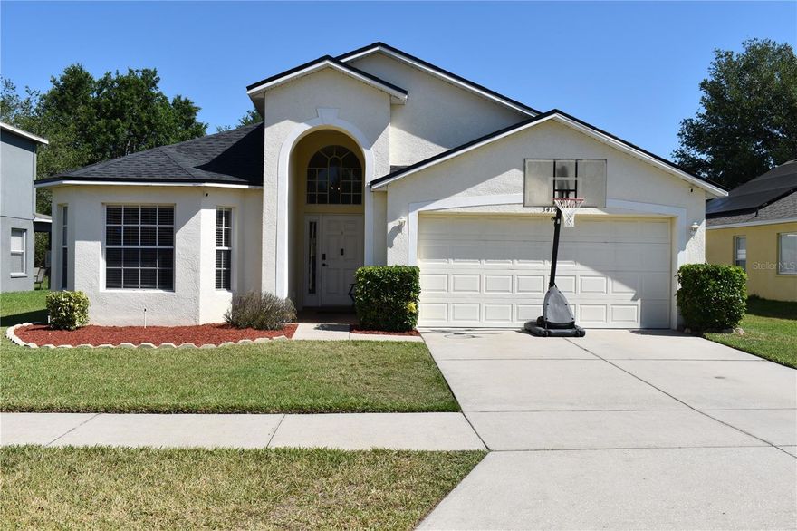 Featuring new never before lived on flooring, this beautifully maintained 4-bedroom, 3-bath gem offers the perfect blend of comfort, style, and functionality. Step inside to high ceilings and a bright, open layout featuring a spacious eat-in kitchen with a breakfast bar — perfect for casual meals, hosting game days, or helping with homework while dinner is cooking. The inviting family room flows seamlessly to a covered lanai and fully fenced backyard, creating a private outdoor retreat for relaxing or entertaining. Host elegant dinners in the formal dining room, perfect for holidays and special gatherings. The primary suite is a true escape, complete with dual sinks, a walk-in shower, and a garden tub for soaking the day away. A front bedroom with a beautiful bay window works perfectly as a home office, guest room, or cozy reading nook, while the other two bedrooms share a convenient Jack & Jill bath. Enjoy peace of mind with a new roof (2024) and new HVAC system (2019). A 2-car garage leads directly to a second entry for those rainy days. Conveniently located near I-4 and Hwy 60, with easy access to schools, shopping, sports parks, and outdoor fun. Don’t miss your chance to call this special place home — schedule your private showing today!
