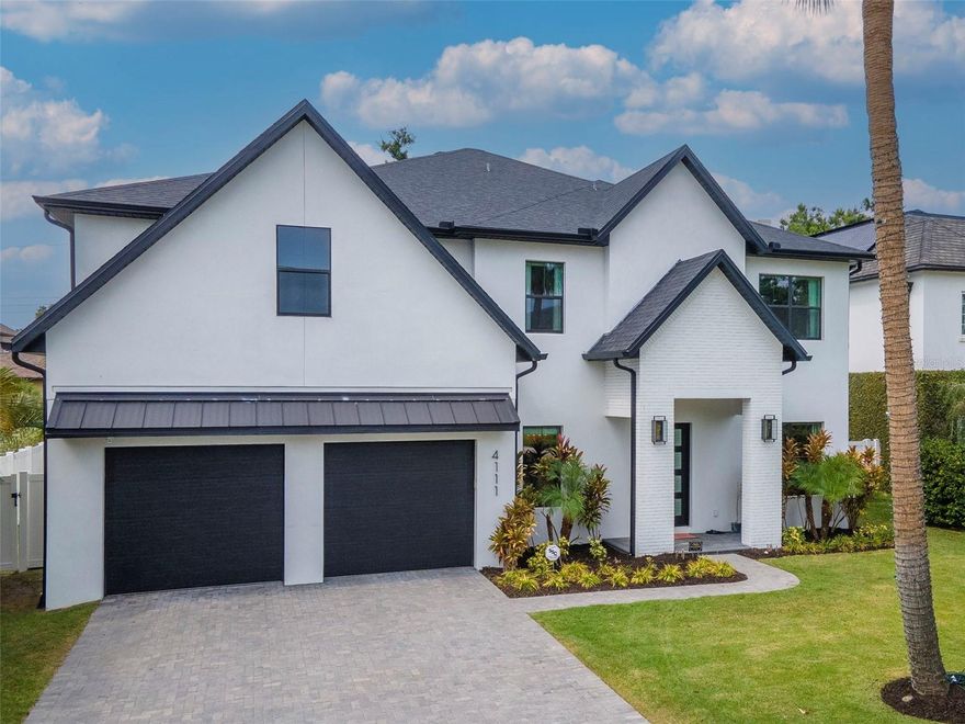 Welcome to an extraordinary blend of luxury, location, and lifestyle in one of South Tampa’s most coveted neighborhoods. This stunning new construction masterpiece by Momentum Homes offers 5 bedrooms, 4.5 baths, and over 4,500 square feet of expertly designed living space—crafted for both everyday comfort and elegant entertaining. This home stood high and dry with no issues throughout hurricane season 24.
Built solid with block construction on both levels and impact-rated Low E windows, this home marries timeless architecture with modern durability. Step inside to find wide-plank white oak flooring, custom wood cabinetry, and a chef’s dream kitchen featuring a 48” Thermador gas cooktop, quartz island, butler’s pantry, and functional mudroom. The open-concept living area is anchored by a showstopping gas fireplace and flows seamlessly into a dedicated office and media room.
Retreat to the first-floor guest suite with en-suite bath and direct pool access—ideal for visitors or multigenerational living. Upstairs, the luxurious primary suite impresses with an oversized walk-in closet and spa-inspired bath complete with a freestanding soaking tub and frameless glass shower.
Out back, enjoy a true resort-style escape: a sparkling pool and spa, covered patio with built-in grill, sink, refrigerator, and lush professional landscaping framed by a classic brick-paver driveway. Zoned for top-rated Grady, Coleman, and Plant schools.
This is more than a home—it’s a statement. Don’t miss your chance to own a rare new construction offering in Swann Estates.