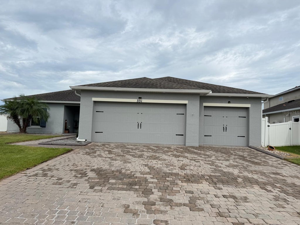 Photo of 331 Quarry Rock Circle, Kissimmee, FL 34758 (MLS # O6446849)