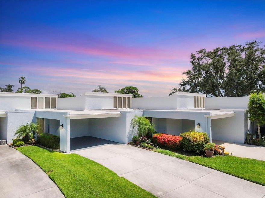 Step into this light-filled, freshly painted gem in the rarely available and highly sought-after El Conquistador Village. Ideally located on a quiet cul-de-sac just steps from IMG Academy, this beautifully updated condo offers sweeping golf course views. Past the oversized parking area and secure iron gate, a charming courtyard welcomes you, perfect for morning coffee. Inside, soaring ceilings and an open-concept layout seamlessly connects the living room and kitchen, ideal for easy entertaining. The kitchen features a butcher block countertop with seating for four, accented by a birch wood wall and stylish backsplash. Both bedrooms are generously sized, with the primary suite offering a built-in office nook and wall-to-wall closets. Bathrooms are finished with floor-to-ceiling tile for a sleek, modern look. Enjoy indoor-outdoor living from the new, spacious screened-in patio accessible from the living room, kitchen, and primary bedroom. A recently replaced roof, no flooding from last year's hurricanes, and full community amenities, including a heated pool and clubhouse. Nestled in the heart of El Conquistador and backing directly onto IMG Golf Course, you're minutes from shopping, dining, and our sugar sand beaches. HOA fees include landscaping, exterior maintenance, pest control, basic cable, master insurance. Please note the back patio is the responsibility of the owner for upkeep and replacement.