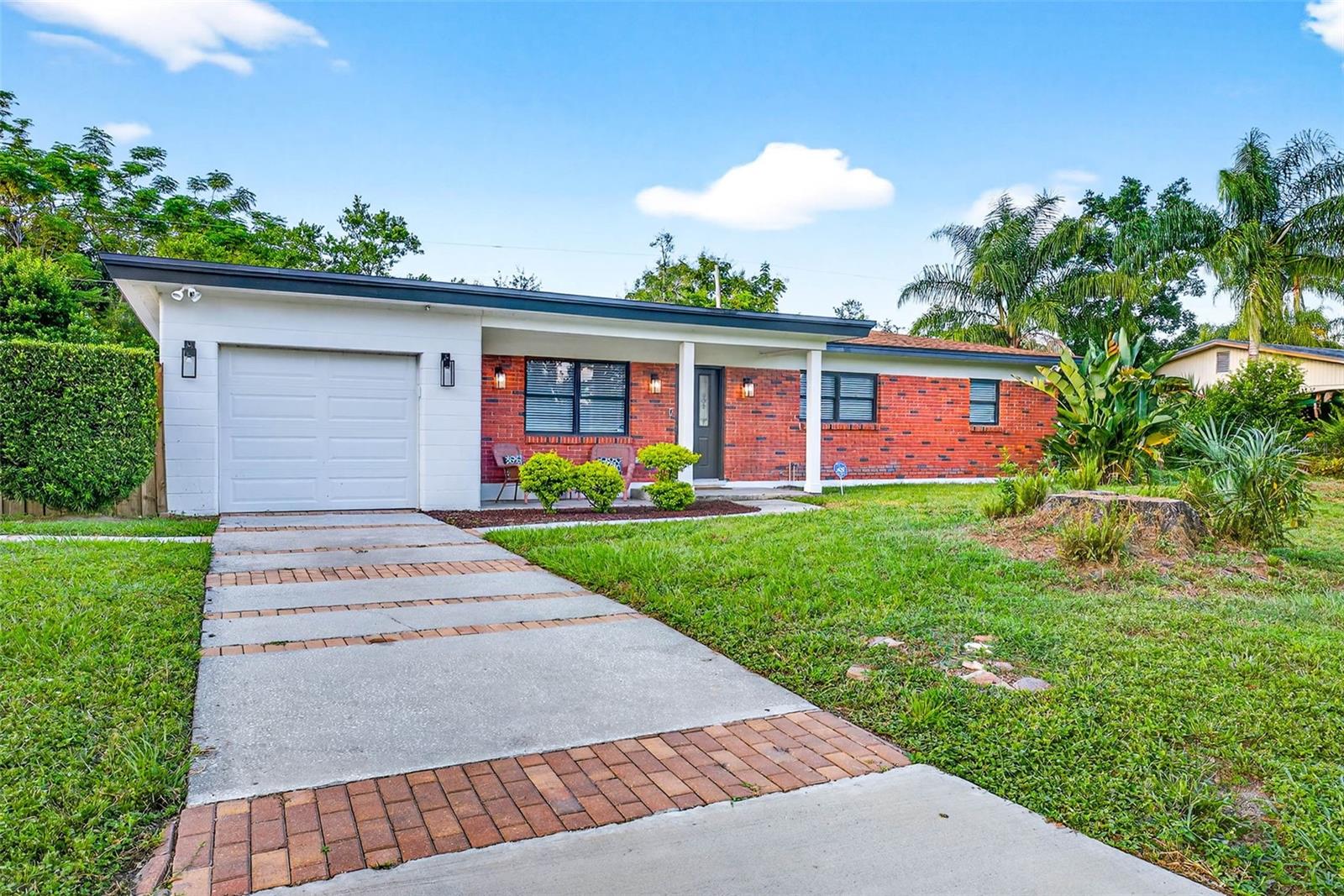 Tucked on Forest Park in the heart of Temple Terrace, this 3 bedroom, 2 bath mid-century beauty combines timeless style with today’s must-have updates. From its curved brick exterior and charming fence to the spacious backyard, the home is filled with character and warmth.
Inside, a large, updated kitchen with granite counters, stainless steel appliances, and ample cabinet space anchors the home. Two oversized living areas — a bright living room and a sun-filled Florida room — create the perfect balance of comfort and flexibility.
The extra-deep garage provides space for two cars, a workshop, and laundry. Recent upgrades include: Roof (2022), AC & ductwork (2019), complete electrical rewire with modern recessed lighting (2022), Water Heater (2023), pest- and termite-resistant insulation (2025), and full re-piping to the city lines. A clean 2025 4-Point Inspection adds extra reassurance.
Just steps to Bonnie Brae Playground, the Temple Terrace Library, and beautiful Woodmont Park, this home places you at the center of a vibrant community. Enjoy year-round city events like the July 4th Parade & Fireworks, Craft Brew Festival, and seasonal markets.
Membership perks include the Family Recreation Center and a free three-month social membership at the Temple Terrace Golf & Country Club for new homeowners. Nature lovers will appreciate nearby Lettuce Lake Park, Hillsborough River State Park, and multiple boat ramps. Families will love the excellent local schools, including the A-rated IB Elementary Magnet.
Conveniently located near I-75, I-275, USF, Moffitt, and major medical centers, with Downtown Tampa and Tampa International Airport just 20 minutes away.
With classic style, a backyard full of possibilities, and updates that give lasting peace of mind, this Forest Park home is the complete package.