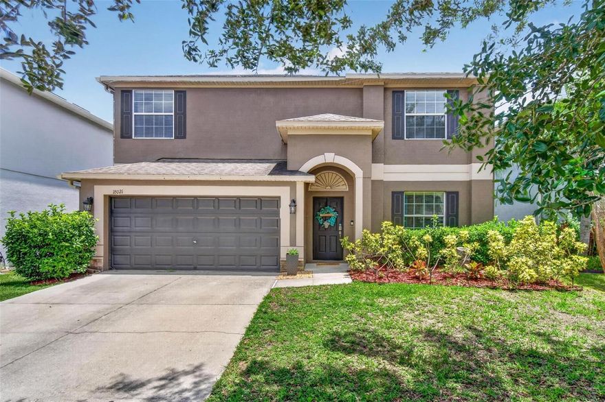Welcome to this beautifully maintained 4-bedroom, 2.5-bath home located in the highly desirable Concord Station community of Land O’ Lakes. Built in 2012 and offering 2,441 sq ft of living space, this spacious home features a bright and functional open floor plan perfect for everyday living and entertaining. The first floor showcases new tile flooring throughout, creating a modern and cohesive look. The oversized kitchen is equipped with granite countertops, beautiful wood cabinetry, stainless steel appliances, recessed lighting, and a large center island with abundant prep and storage space.

The inviting living and dining areas offer excellent natural light and seamless flow to the covered screened lanai and fully fenced backyard — ideal for entertaining, pets, or future pool plans. Upstairs, the spacious primary suite features a large en-suite bathroom with dual sinks, a garden tub, walk-in shower, and generous closet space. Additional upgrades include a new water heater installed in December 2024, all new toilets installed in July 2023, and a softener/carbon filter combination filtration system installed in December 2025. New faucets will also be installed prior to closing.

This move-in ready home also offers a 2-car garage, great curb appeal, and has been exceptionally maintained inside and out. Concord Station residents enjoy resort-style amenities including a large community pool, splash pad, fitness center, clubhouse, playground, basketball courts, and tennis courts. Conveniently located near top-rated schools, shopping, dining, parks, and major roadways with easy access to Tampa and surrounding areas. Schedule your private showing today!