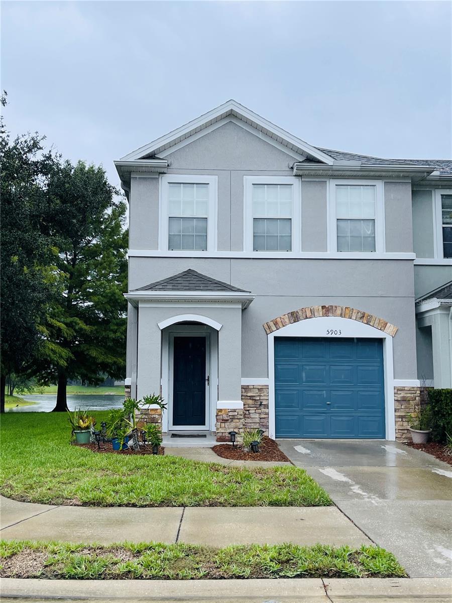 It's a rare find - low-maintenance living in an exclusive community, End-Unit, Lakeview Townhome at Stonefield in Bartram Park. Step inside to a spacious main floor living space boasting a modern kitchen with breakfast bar seating, sleek cabinets and counters, and a contemporary tile backsplash. The combined living and dining areas provide ample space for entertaining or winding down at the end of the day. Enjoy added features like a downstairs half bath, ceiling fans, beautiful natural wood finishes, a screened lanai, and an attached garage with extra storage. The roomy main bedroom offers tons of natural light and an ensuite bathroom with a walk-in closet. The second bedroom and bathroom are on the opposite end of the home for added privacy. The upstairs loft can double as an office, den or simply convert it to a 3rd bedroom. Relax on the screened patio with a view of the lake, enjoying serene water-to-preserve views in this prime location. Venture outside your front door and take your evening stroll through the preserve. Embrace the feel of a single-family villa in a serene, tree-lined community with amenities like a resort-style pool, gathering spaces, and scenic walking paths throughout the community. Conveniently located to interstate connections, medical centers, Durbin Pavilion, retail shops, and an array of dining choices. Additionally, two Publix Grocery options are only minutes away. Don't miss out on this exceptional opportunity!