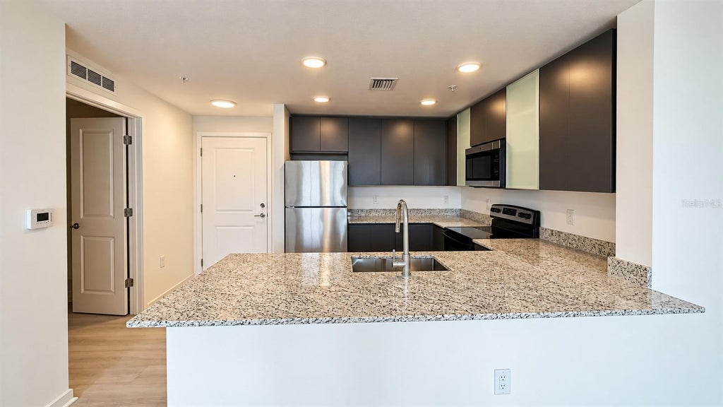 Photo of 5587 Millenia Boulevard #213, Orlando, FL 32839 (MLS # O6452667)