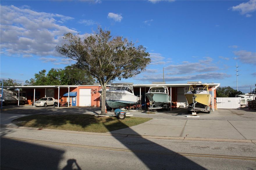 Opportunity of a lifetime! INDUSTRIAL MANUFACTURING WAREHOUSE & OUTDOOR STORAGE. PROPERTY FEATURES 11,780 Square footage on 1.5-acres, 5-units industrial warehouse condos; one converted to office with 2 bed/2bathrooms condo with pool. All units with hurricane shutters, oversized garage doors and covered parking. Private road leads into fenced outdoor storage for boats, RVs, other vehicles, and features coded gate entrance with camera surveillance. 42 vehicle spots rented monthly.  Leaseholds in place for all tenants in the warehouse condo units. Signage Large pole in front to assist owner and tenants with marketing and advertising, on street.  No flooding and high dry property!