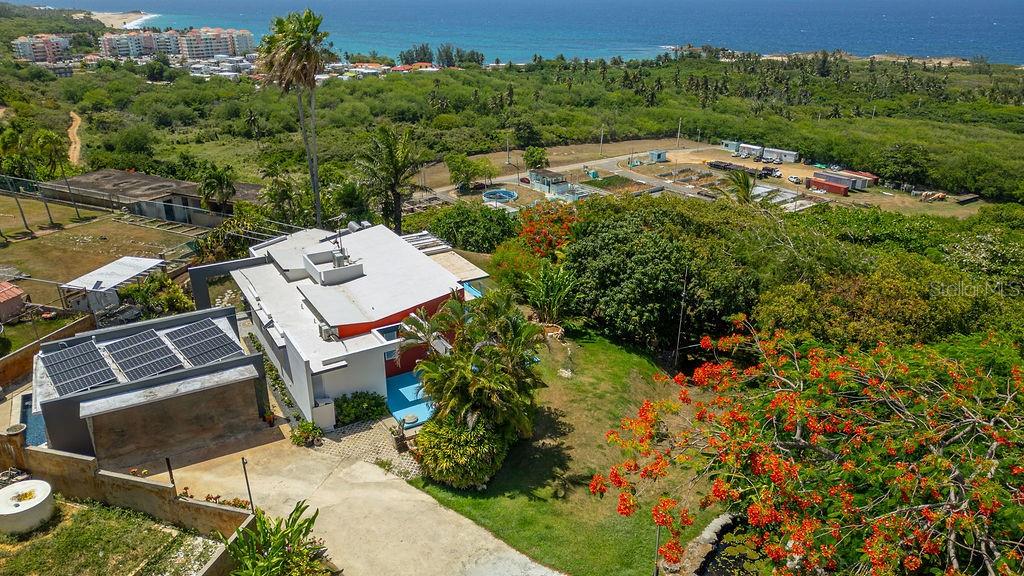 Live the Paradise Lifestyle in Isabela!
Located at 52 Calle Pascua in Urb. Corchado, Isabela, this unique residence combines thoughtful design, comfort, and the laid-back lifestyle of Puerto Rico’s stunning northwest coast. Designed in 2002 by renowned architect Bernardo Moreno, the home was built to embrace privacy and its natural surroundings.
Set on an expansive 4,166.21 sq. m. lot, the property provides ample room to expand or further develop. The residence is move-in ready and features 12 fully paid 15-kW solar panels, a solar water heater, and a private swimming pool surrounded by lush greenery. With three bedrooms, two and a half bathrooms, spacious interiors, and parking with easy access to main roads, the home offers comfort, functionality, and investment potential.
Whether as a primary residence, vacation retreat, or high-value rental property, this home is ideally located just minutes from Isabela’s vibrant town center and the world-famous Jobos Beach. With no HOA fees and plenty of room to grow, it presents an exceptional opportunity to own in one of Puerto Rico’s most coveted coastal destinations.