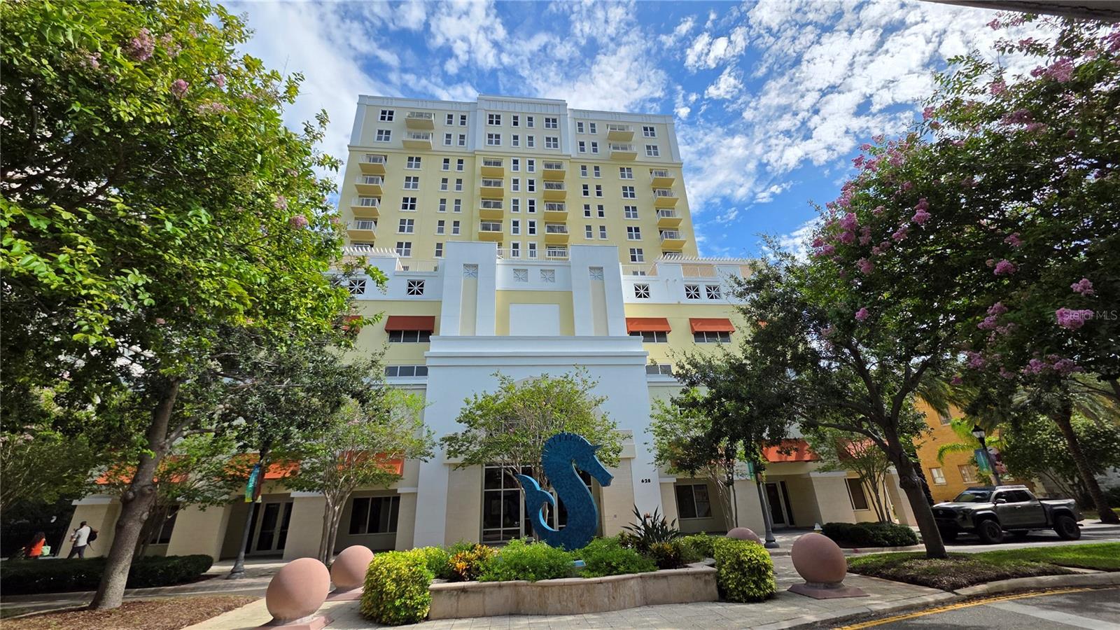 Fully Furnished, Move-In Ready
Welcome home to this beautifully appointed top-floor condo for rent in the heart of Downtown Clearwater. Located at 628 Cleveland St, Unit #710, this expansive 1-bedroom + den, 2-bath unit offers 1,489 sq ft of bright, stylish living space—fully furnished and ready for immediate occupancy.
Enjoy a spacious open-concept layout with warm tones and modern finishes, including granite countertops, cherry wood cabinetry, stainless steel appliances, and elegant lighting throughout. The versatile den is perfect for a guest suite, office, or creative studio. The oversized primary suite includes a walk-in closet and ensuite bath with dual sinks.
With in-unit laundry, one reserved parking spot, and full access to building amenities like a fitness center and pool, this rental offers both comfort and convenience. Set in a secure building and just steps from Coachman Park, Clearwater’s best dining, and minutes from Clearwater Beach, you’ll love the easygoing, walkable lifestyle this location offers.
Rent: $2,950/month — includes furnishings, parking, and building amenities.
Start your next chapter in a space that feels like home from day one.