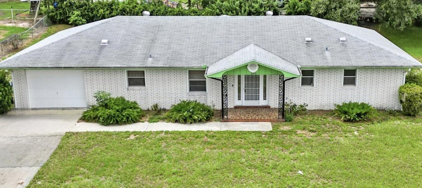 This 2 bedroom 2 bath home has so much to offer!! As you enter the entryway you are greeted with the very large Combination Living Room/Dining Room, with its arched entryways. The Kitchen is also very spacious with a breakfast bar, as well as a designated Breakfast Area. The appliances are in good working order. Tons of storage in this Kitchen. The Master Bedroom is large and the Master Bathroom is huge!! You will find the large walk in closet off the Master Bath. The 2nd bathroom offers one sink and a bathtub/shower combo. Off of the large living rooms is sliding glass doors to a screened lanai over looking your spacious back yard all on a oversized lot.
Roof is 2015, AC 2019, Water Heater 2016 , also a water filtration system.... This home just feels right!!! It will need cosmetic updates but once you add your personal touch you will have a home you will want to stay in for a long time ... This home also sits one house back and sits up from Little Lake Hamilton, so you do have a slight view. No HOA fees in this community!! Home is being sold AS IS for Sellers Convenience.
