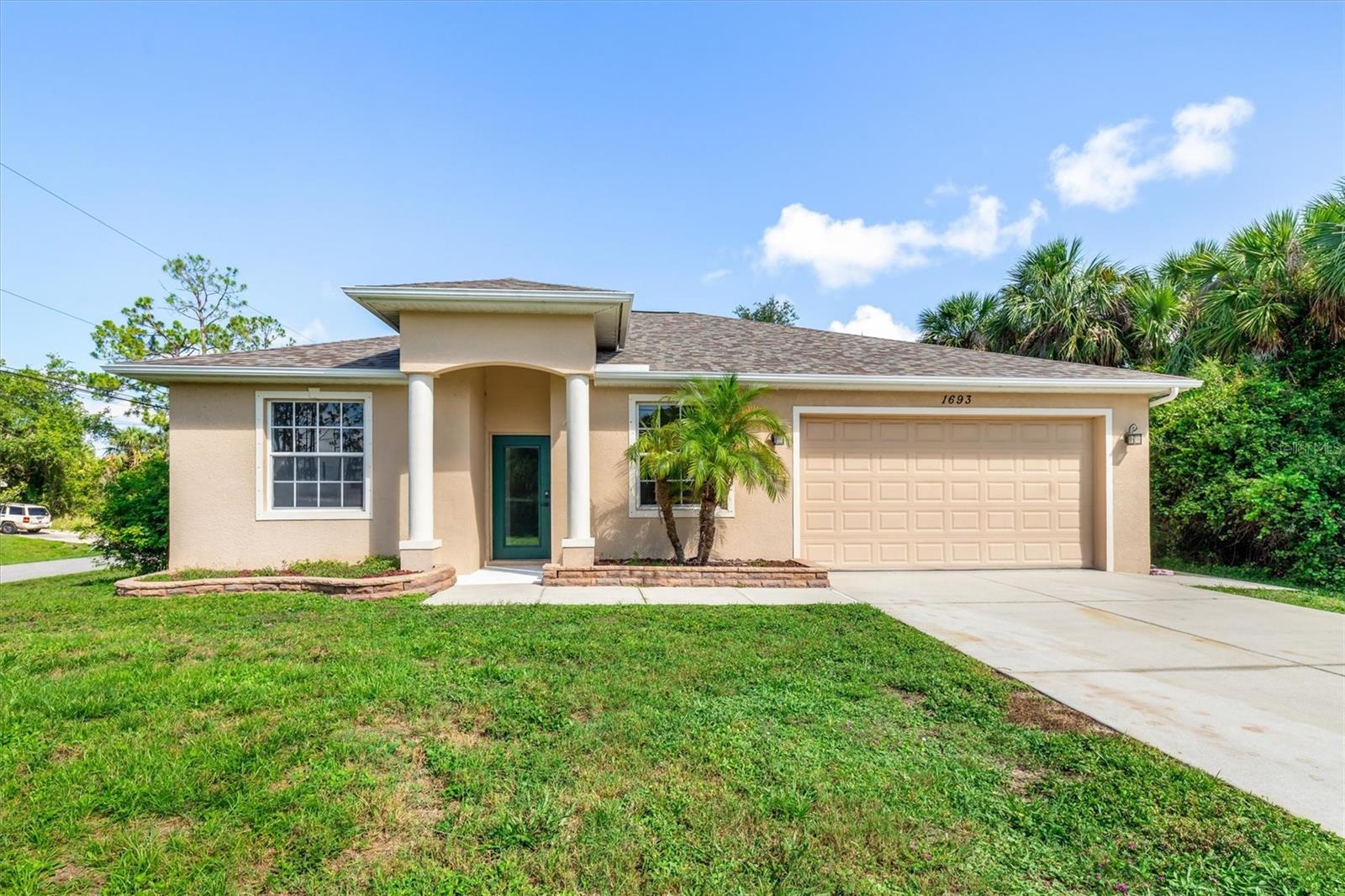 NO HOA, CDD, or FLOOD ZONE! This beautifully updated home sits on a generous 1/4-acre treed and fenced lot that is perfect for privacy and outdoor enjoyment with possible space for a pool The open-concept design flows seamlessly, The front dining and living areas are great for entertaining. The large family room has ample space for family and friends. While the split-bedroom layout offers privacy, with the primary suite on one side and two additional bedrooms on the other. Relax outdoors on the spacious screened lanai. Features include a large 2-car garage, updated HVAC, luxury vinyl and tile flooring, and a newer roof (2022). Recent upgrades include modern kitchen and bathroom cabinets, quartz countertops, stainless steel appliances, and fresh interior paint. Nestled in lively North Port, this home blends comfort, style, and value. Don’t miss out!