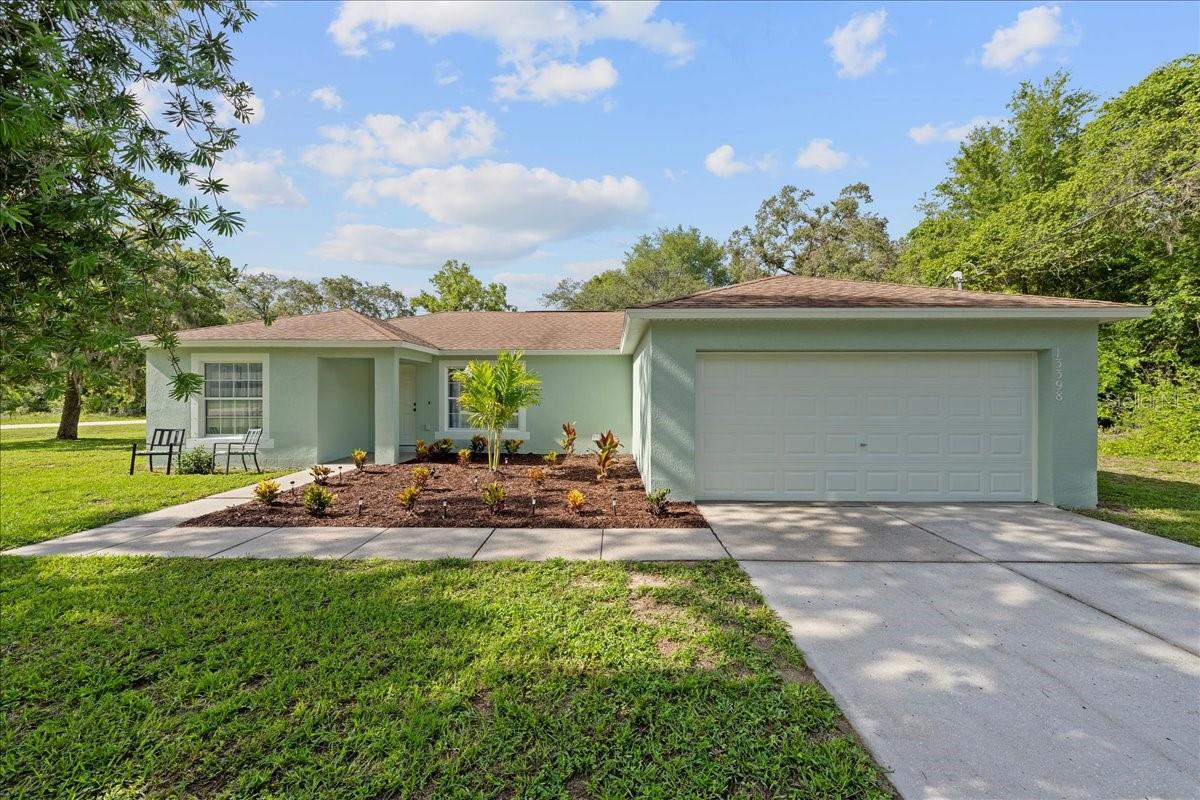 This beautifully updated 3-bedroom, 2-bathroom home in the desirable Royal Highlands neighborhood offers the perfect blend of modern upgrades, thoughtful design, and room to breathe, with no HOA and on a corner lot of half an acre. Built in 2007, this one-story home has been tastefully renovated from top to bottom. The kitchen is truly the heart of the home, featuring a stunning waterfall butcher block island, stainless steel appliances, soft-close cabinetry, a deep kitchen sink, and designer lighting. Just off the kitchen, you'll find a custom-built wine bar complete with a wine fridge and display shelving, perfect for entertaining or unwinding after a long day. There's also a separate coffee bar and pantry storage area that adds both style and function. The spacious floor plan includes a light-filled living room, dedicated dining space, and generously sized bedrooms. Nearly the entire home has been refreshed, including a fully remodeled bathroom, new fixtures throughout, fresh interior and exterior paint, and updated landscaping that adds great curb appeal. Major improvements include a brand-new hot water heater (2024), a new drain field, and a new well pump and bladder (2023), giving peace of mind for years to come.
Located just a short drive to Homosassa, Brooksville, Weeki Wachee, shopping, restaurants, and medical facilities, this move-in-ready home offers the freedom of no HOA and the space you’ve been searching for, inside and out. Don’t miss your chance to make it yours!