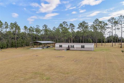 Photo of 14421 NW 214th Terrace, High Springs, FL 32643 (MLS # GC535834)