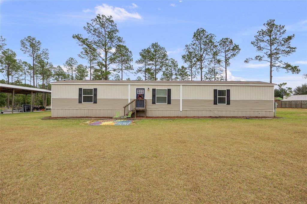 Photo of 14421 NW 214th Terrace, High Springs, FL 32643 (MLS # GC535834)