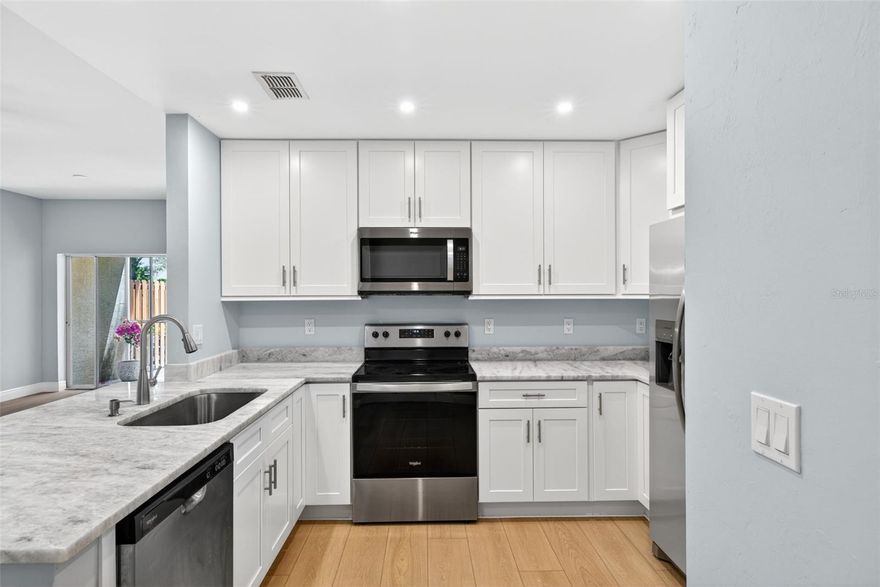 Completely reimagined from top to bottom, this designer-renovated 3-bedroom, 2-bath residence offers a level of finish rarely found in Bellasol. Featuring a stunning new kitchen with marble countertops, stainless steel appliances, custom cabinetry, fully renovated bathrooms, new flooring, fresh paint, and updated fixtures throughout, every detail has been thoughtfully curated for a true move-in-ready experience. The spacious first-floor layout combines modern style with easy Florida living, ideal for year-round residents, seasonal owners, or buyers seeking a low-maintenance luxury lifestyle. Located in the gated Bellasol community with resort-style amenities including a pool, fitness center, and clubhouse, all just minutes from Downtown Fort Myers, I-75, shopping, dining, and SWFL beaches. A rare opportunity to own one of the most extensively updated condos in the community — simply unpack and enjoy.