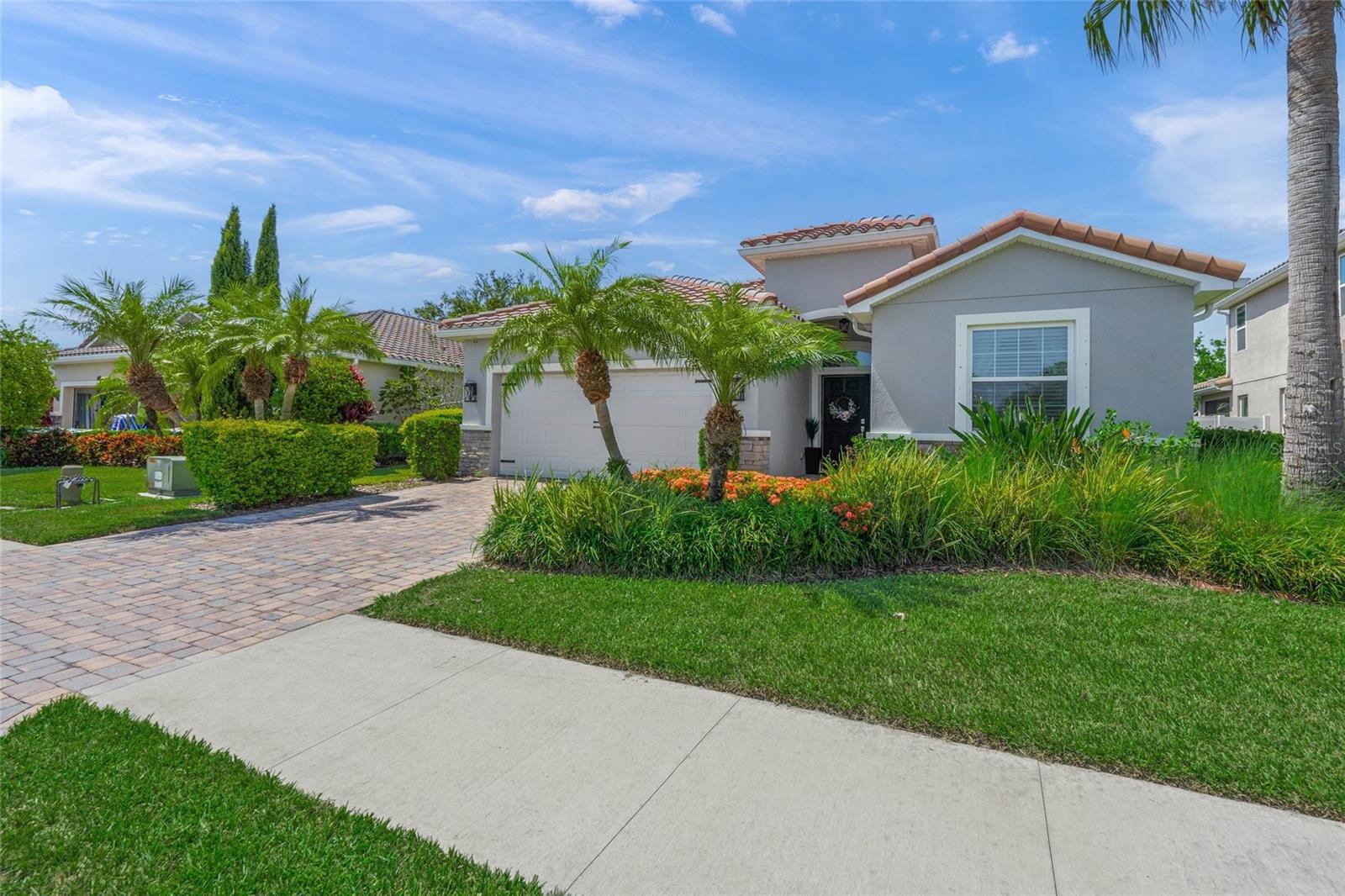 Welcome to the gated community of Ashton Pointe, an enclave of 49 maintenance-free homes. Minutes to I-75, A+ rated schools and Siesta Key. The low association dues include gated entry, lawn and landscape maintenance, irrigation, and community playground with no CDD fees. Quality construction built by DR Horton, this Lantana floorplan is 2062 Sq. Ft., 3-bedrooms, den, 2.5 baths, 2 car garage. This is an FPL certified energy efficient home with 15 seer AC, radiant barrier roof sheathing, double pane thermal low E windows,. Exterior features include barrel tile roof, hurricane shutters, brick paver Driveway and entry, stone accents, and fenced property. Interior upgrades include crown molding, wainscot interior paneling, window casing, and upgraded light fixtures. Tile flooring throughout the main living areas with laminate flooring in the den and main bedroom. The kitchen, fronted by the large island/breakfast bar and granite countertops, tiled backsplash, stainless steel appliances, 42" staggered cabinets, and a corner pantry. The open concept floor has a specious great room with decorator's touches, and it's wired for surround sound. The den can be used for formal dining, office or playroom. The Main Bedroom offers two spacious closets, one with custom shelving. Adjoined is the main bath featuring dual vanities, garden tum, tiled shower, and private water closet. Extra perks include a screened in patio with tiled floor and bar for entertaining and heavy-duty overhead garage storage.
