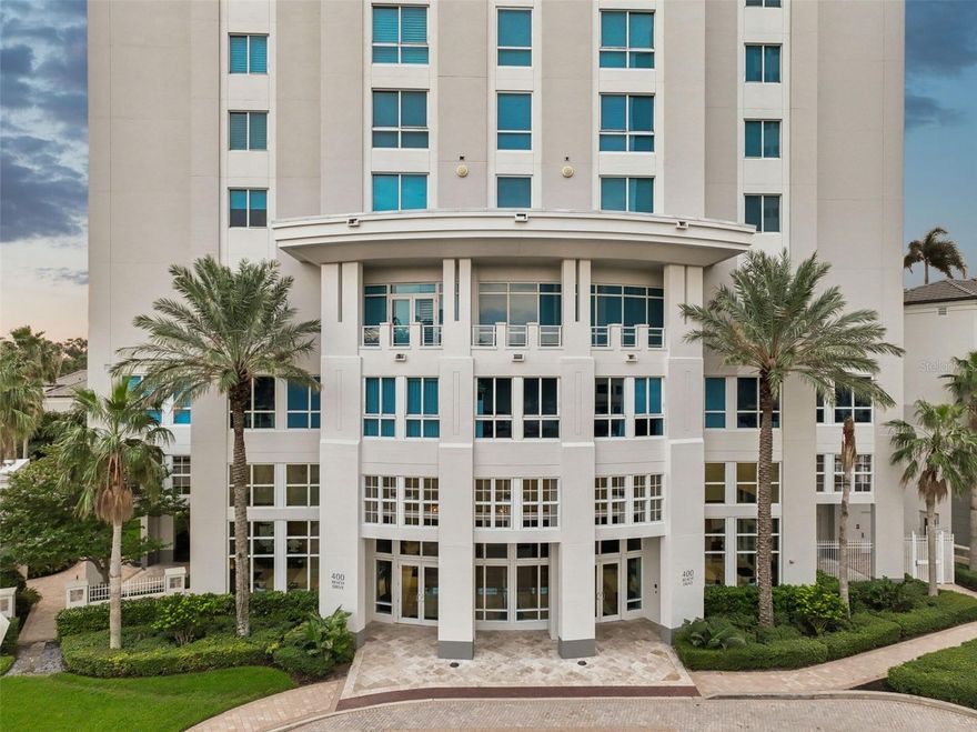 THIS LUXURIOUS CONDO IS AVAILABLE FURNISHED OR UNFURNISHED. Welcome to one of the most coveted luxury residences in downtown St. Petersburg, located on distinguished Beach Drive in the highly sought-after 400 Beach high-rise. This hurricane-rated building is situated at the highest elevation [flood-evacuation zone C], offering both safety and sophistication. Perched on the 12th floor, this condo is one of the few with spectacular views that will never be blocked.  This beautifully renovated 3-bedroom, 3-bathroom condominium (with 2 en-suite bedrooms), plus a separate den/media-room and laundry room, presents a rare opportunity to experience cosmopolitan living at its finest for under $2.5MM. Step off the elevator into your private foyer and enter through double doors into a bright, spacious home with breathtaking floor-to-ceiling views of Tampa Bay, the St. Pete Pier, Albert Whitted Airport, and the Sunshine Skyway Bridge. The open floor plan, featuring high ceilings, crown molding, and wood flooring, is perfect for entertaining. Upgraded hardware, lighting, plumbing fixtures, custom blinds and blackout shades in all three bedrooms add to the home’s luxurious appeal. The gourmet kitchen is a chef’s dream, boasting granite countertops, maple cabinetry, and top-of-the-line appliances, including a brand-new KitchenAid custom refrigerator, GE Monogram convection/microwave combo, Bosch dishwasher, built-in coffee/cocktail bar, wine fridge, warming drawer, and an Aquasana water filtration system. The primary bathroom has been fully renovated with a dual rain-head shower, new vanities, sinks, toilet, linen closet, stunning tile work, tinted windows, Bluetooth speakers, and a candle wall for added ambiance. Enjoy your morning coffee or evening wine on the private terrace, where sweeping views of downtown St. Pete and Tampa Bay await. Additional features include a Moen Flo water security system, new tankless water heater, separate air-conditioned storage unit and two side-by-side deeded, covered, and secured parking spaces with an EV charging station. The 400 Beach building offers an array of resort-style amenities, including 24-hour concierge service, a state-of-the-art fitness center, a heated swimming pool and jacuzzi, outdoor grills, a covered outdoor fireplace, and more.  You can take the elevator and instantly be at St. Pete's hottest new restaurant, "Juno & Peacock," and its adjacent bar, "Pluma."  Steps from your door, you’ll find world-class dining, green spaces, the historic Vinoy Hotel, renowned museums, and cultural landmarks. Don’t miss the chance to make this premier waterfront residence your new home. Schedule your private showing today!