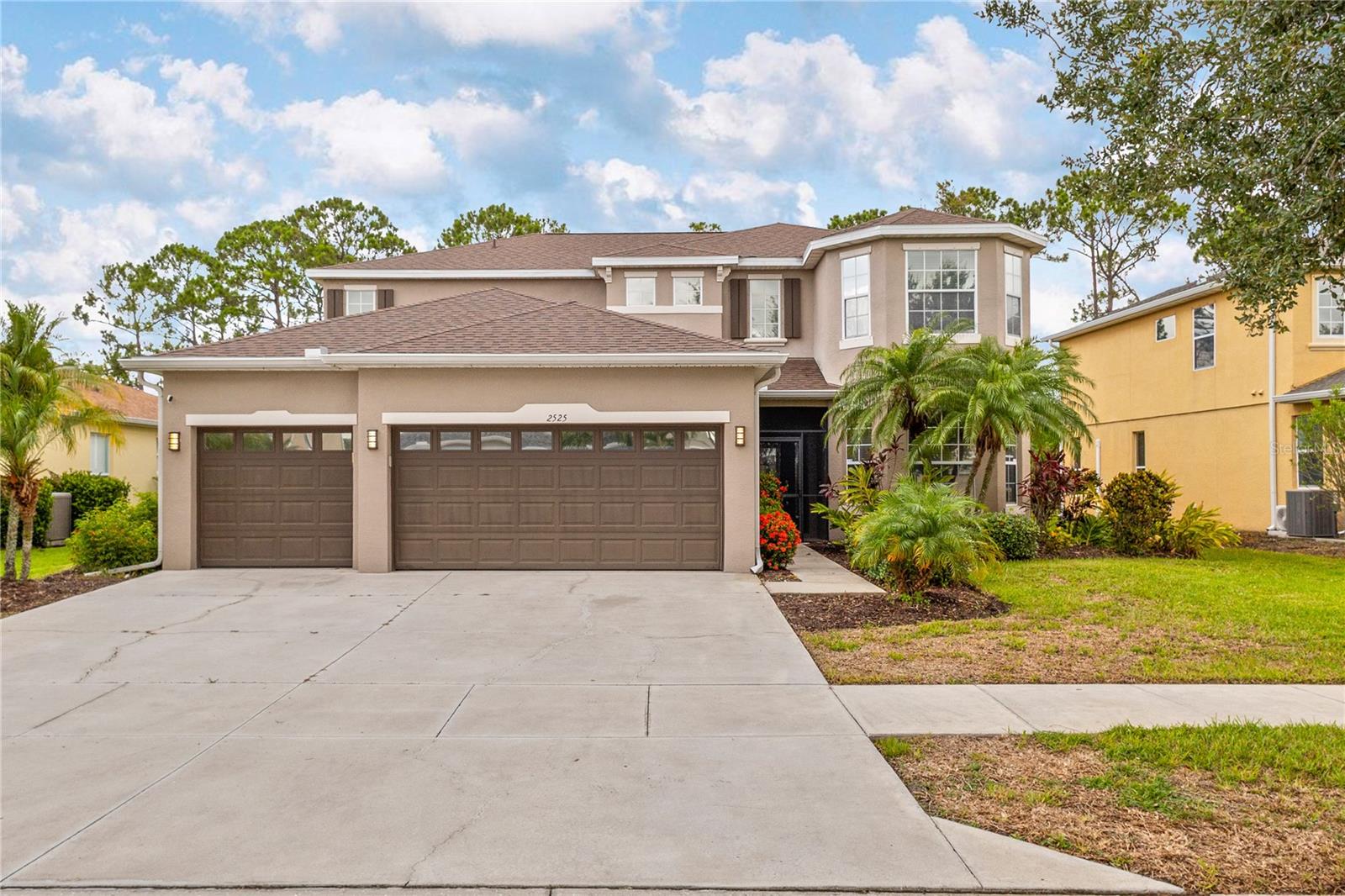 This spacious 5 bedroom, 3.5 bath home resides in the desirable quite family community of Cedar Grove at the Woodlands. This home offers a heated inground private pool enclosed in a covered lanai, that can be seen from the kitchen and great room that has soaring ceilings through large sliding glass doors. The kitchen with all stainless steel appliances has a walk-in pantry, beautiful tall wood cabinets and a granite breakfast bar that overlooks the great room. An open floor plan with over 2900 sq feet of natural light to show off the newly painted interior and air conditioned space from units only 3 years old, it's perfect for hosting gatherings for family and friends. The spacious master bedroom is conveniently located on the lower level with large sliding glass doors overlooking the pool. Surrounding the pool are trees that create privacy. The master bathroom has a jacuzzi tub with a separate standing shower and dual sinks. Walk upstairs and you will find four large bedrooms all with large closet space. Two of the rooms share a Jack and Jill bathroom. The community perks include a resort style community pool with a BBQ grill, playground and sidewalk-lined streets. Conveniently located close to I-75, shopping, dinning, beaches and golf courses. This home is located in a X flood zone, which means most insurance companies will not require flood insurance! Come see what a gem this home is!!!!!