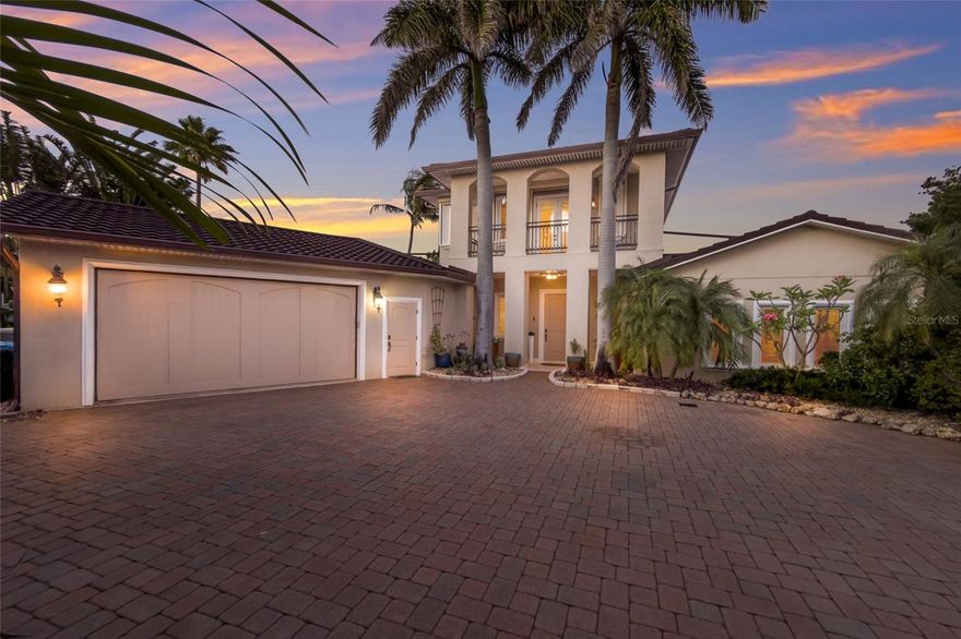 One or more photo(s) has been virtually staged. Imagine arriving at a private estate tucked along the shimmering waters of Tampa Bay on Anna Maria Island, where 235 feet of pristine waterfront create a rare sense of space, privacy and uninterrupted views. This four-bedroom, six-bath coastal residence in Holmes Beach is designed to capture the beauty of the bay from nearly every angle. Expansive walls of glass and sliding doors frame panoramic water vistas, filling the home with natural light and bringing the outdoors in, a hallmark of luxury waterfront homes in this area. Inside, the home blends refined elegance with relaxed island living. A grand open-concept layout connects the living room, dining area and a chef’s kitchen outfitted with high-end appliances, custom cabinetry and generous entertaining space. Multiple living areas, often found in premier Anna Maria Island homes, offer flexibility for hosting guests or enjoying quiet retreats. Each of the four bedrooms is generously sized, while the six total baths provide a resort-style convenience ideal for family and guests. The primary suite is typically a sanctuary of its own, featuring water views, private balcony access and a spa-inspired bath. Outside, the property becomes exceptional. A resort-style pool and spa overlook the bay, surrounded by lush tropical landscaping and expansive outdoor living areas designed for entertaining or unwinding in the coastal breeze. Waterfront homes here often emphasize seamless indoor-outdoor flow, creating an island lifestyle experience. With 235 feet of frontage, the property offers a private dock and boat lift, ideal for direct access to the open waters of Tampa Bay and the Gulf beyond. Whether you’re setting out for a sunset cruise, fishing at dawn or simply watching dolphins and manatees pass by, the water becomes an extension of daily life. Set on one of the desirable stretches of Anna Maria Island, this home combines rare waterfront scale, luxury amenities and effortless boating access, a showcase of elevated coastal living.