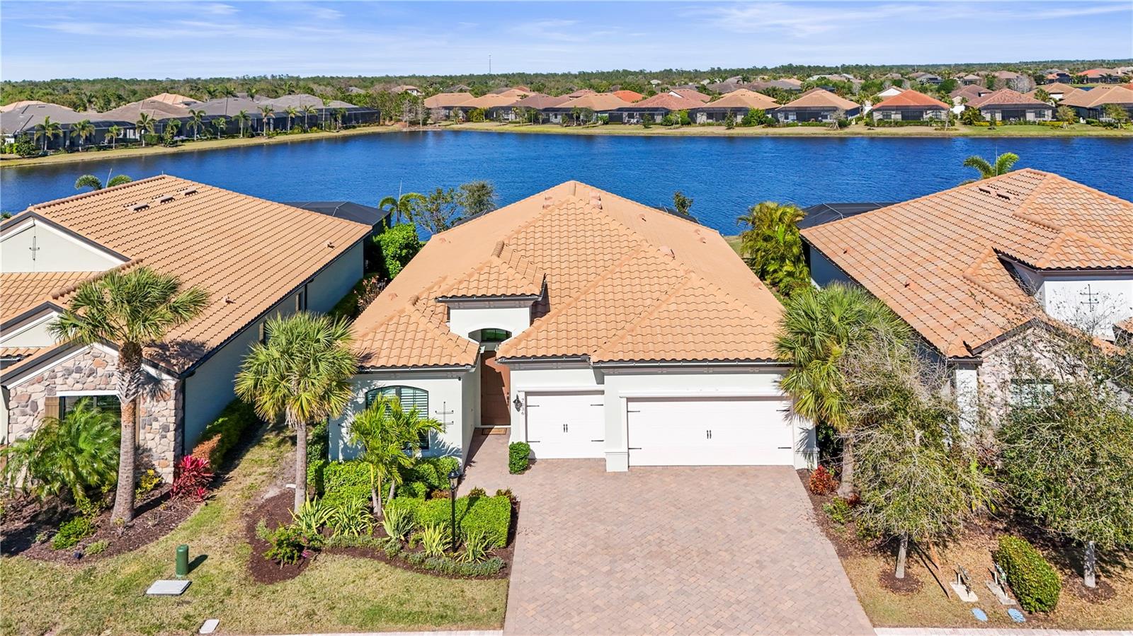 Experience the ultimate in luxury waterfront living with this stunning 4-bedroom, 3-bathroom pool home in the exclusive Country Club East community of Lakewood Ranch. A lease-to-own option is also available, offering a rare opportunity to enjoy the Florida lifestyle now while planning for future ownership.
Designed for comfort and elegance, this open-concept home offers breathtaking water views and a seamless indoor-outdoor lifestyle. The gourmet kitchen features stainless steel appliances, quartz countertops, and ample cabinetry, while the separate formal dining room provides a refined space for entertaining.
The primary suite, tucked away at the back of the home, offers a spa-like ensuite with a soaking tub, dual quartz vanities, and a walk-in shower. Step outside to the pavered lanai, where you'll find a saltwater heated pool and spa overlooking tranquil water views, along with a fully equipped outdoor kitchen—perfect for Florida living.
Additional highlights include hurricane impact windows, a 3-car garage, and a tankless hot water heater for energy efficiency.
As a Country Club East resident, you'll enjoy access to The Retreat, an exclusive resort-style amenity center featuring a pool, fitness center, and billiards room. Additionally, The Residents Club offers another pool, spa, and volleyball court. Just moments away, the Lakewood Ranch Golf & Country Club provides 54 holes of golf, 20 Har-Tru tennis courts, 20 pickleball courts, multiple pools, and The Lodge bar & restaurant. Various membership packages are available to enhance your lifestyle.
Don’t miss this opportunity to lease—and potentially own—this luxurious, move-in-ready waterfront home in one of Lakewood Ranch’s most sought-after communities. Schedule your private showing today!