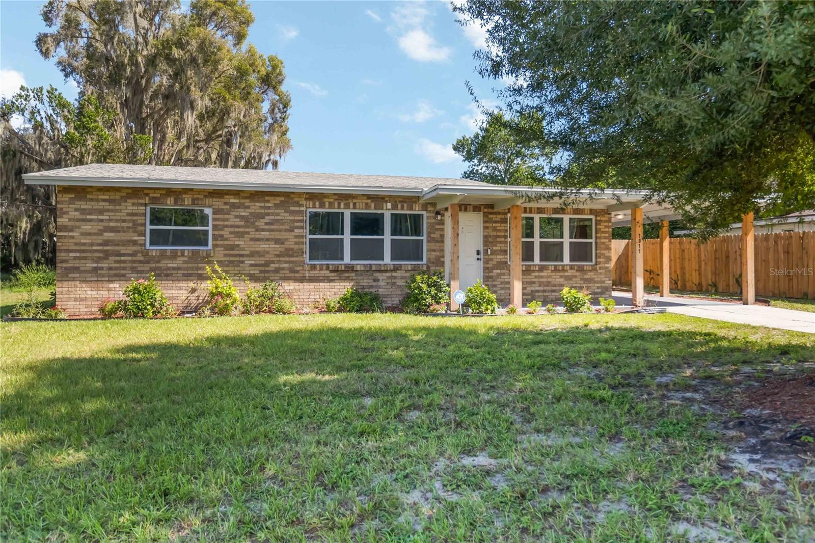 One or more photo(s) has been virtually staged. Turnkey 3 Bedroom- 1 Bathroom home has been completely remodeled, sits on a large lot and comes with lake views! Step inside to a beautifully
renovated space featuring all-new vinyl plank flooring, fresh paint, and updated lighting and plumbing fixtures. The spacious eat-in kitchen is a
chef's delight with new granite countertops and new wood cabinetry with soft-close doors and drawers. The split floor plan offers two bedrooms
plus the third bedroom currently set up as a bonus room. The bathroom has also been completely refreshed with new tile, a new vanity, and a
new toilet, plus a new showerhead with a water softener for added comfort. The home has been meticulously updated for peace of mind,
including a new HVAC system and new ENERGY STAR windows for superior energy efficiency. The old septic system has been bypassed and is
serviced by city water and sewer, and a new laundry vent has been installed. For extra security, all windows are equipped with security sensors,
and the home is protected by storm shutters. The property sits on a huge, private lot with a relaxing water view. The updated irrigation system
keeps the landscaping lush. The backyard is host to mature guava and mulberry trees! Best of all, there's no HOA, giving you the freedom to enjoy your home without restrictions like generating income from renting out space for RV or boat storage or adding an Accessory Dwelling Unit (ADU) for rental income. Ideally located just steps from beautiful Lake Ariana, this home offers the best of both worlds: a serene lakeside setting with easy access to shopping, dining, and the
excitement of Orlando. Tour Today!