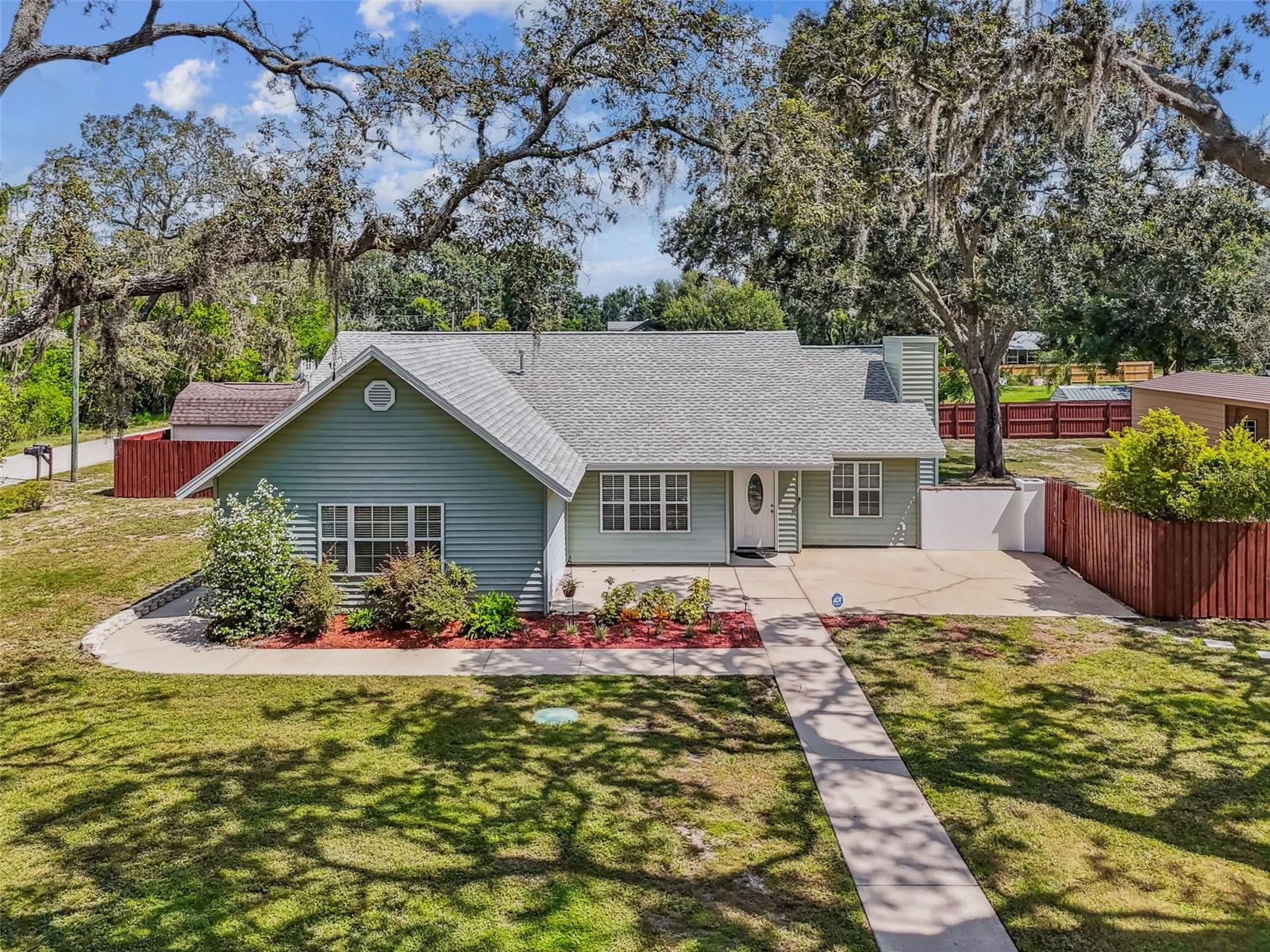 Welcome to the best value in Odessa in Steinbrenner school district! Zoned ASC-1 with NO HOA, this agricultural zoning allows for so much freedom and independence! Nestled in a serene neighborhood on almost a half acre in a top rated school district, this stunning 3-bedroom + office (could easily be a 4th bedroom), 3-bath residence offers the perfect blend of comfort and elegance. This home is CLEAN and neat as a pin and ready to move in! As you step inside, you'll be greeted by a spacious open floor plan featuring a sun-drenched living room with gleaming hardwood floors and vaulted ceilings plus large windows that invite an abundance of natural light. The modern kitchen has stainless steel appliances, granite countertops and butcher block wood counter tops with solid wood cabinets. Adjacent to the kitchen is a cozy dining area, perfect for entertaining guests or enjoying family meals. There are 2 primary suites, each complete with a walk-in closet and their own private bathrooms. One of them has a luxurious soaking tub and separate shower, plus its own exterior entrance. The other en-suite bedroom has a traditional tub and shower, plus vaulted ceilings and a massive walk in closet. The additional bedroom is generously sized, offering comfort and flexibility for family, guests, and there is an office/bonus room that can be used as a 4th bedroom or a home office. Step outside to your private backyard retreat complete with a concrete pad and short wall for sitting or decorating with plants, making it ideal for relaxing afternoons or summer barbecues. The yard is fully fenced and there is a storage shed. Perfect for all your pets! This home also includes a detached metal building that can be used as a workshop, a 30 x 40 6 inch deep concrete pad that can be used as the foundation for a detached garage, boat or RV parking, and 1 car port space. This Odessa home is conveniently located near top-rated schools, shopping, and dining. Home comes with newer LG front load washer and dryer, making it truly move in ready! It's been professionally cleaned and is just the most adorable and best value home in Odessa!
Don't miss the opportunity to make this exquisite home yours. Schedule a showing today and experience all it has to offer!