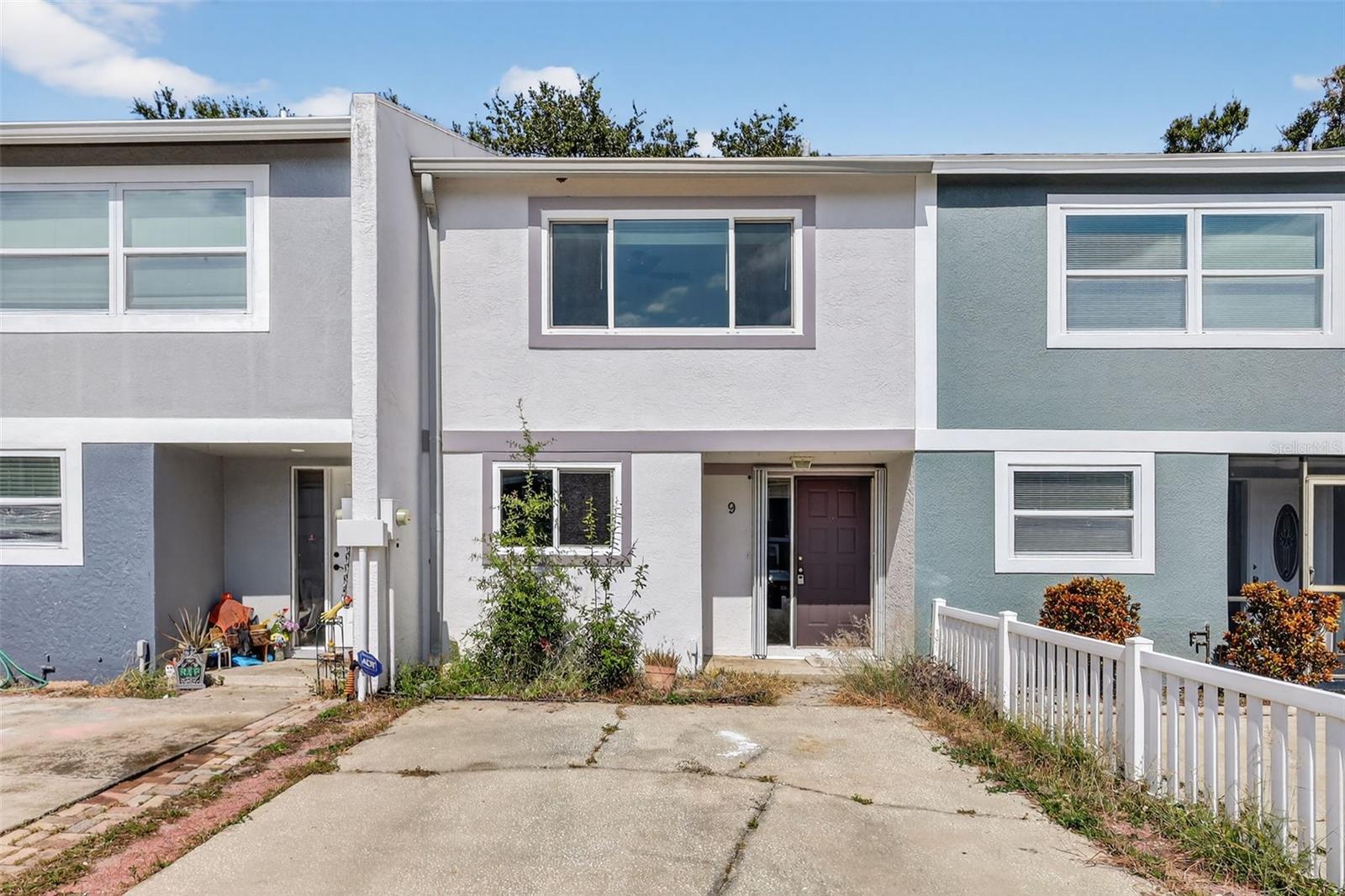 One or more photo(s) has been virtually staged. No HOA • No Deed Restrictions • No Short-Term Rental Limits*Discover the freedom to live or invest your way with this versatile 2-bedroom, 1.5-bath townhome—perfect for homeowners and investors alike. With no HOA fees, no leasing restrictions, and Airbnb-friendly policies, this property offers rare flexibility in today’s market.  Step inside to a bright, open-concept living and dining space, complemented by a convenient half bath and a well-equipped kitchen ideal for hosting or everyday cooking. Slide open the doors to your private fenced patio, a tranquil garden retreat perfect for morning coffee, evening unwinding, or giving your pup room to roam.  Upstairs, enjoy two spacious bedrooms with generous closet space—including a walk-in closet in the primary suite—and a full bathroom with direct access from the primary bedroom.  Nestled on a quiet street, this townhome offers the perfect balance of privacy and convenience—just minutes from the beach, top dining spots, shopping centers, and easy access to downtown Tampa and St. Pete.