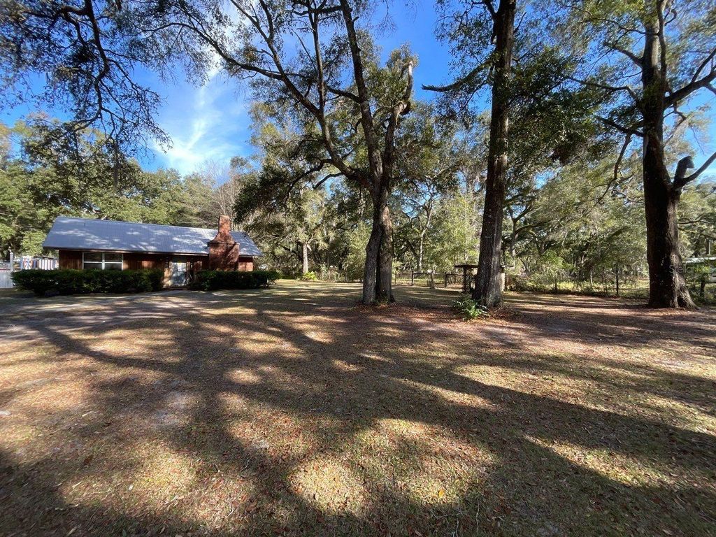 Photo of 8233 NE Highway 353, Old Town, FL 32680 (MLS # O6375312)