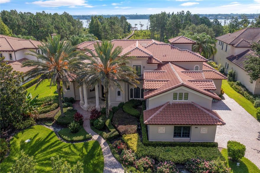 PRICED TO SELL AND MOVE IN READY!!   Remarkably well designed, well PRICED and located in Keene's Pointe, this 5BR/5 FULL Bath/ONE Half Bath, custom Lakefront Estate built by Master Custom Builder Goehring and Morgan awaits your arrival.   Thoughtfully designed with a family in mind, this home features a 4-CAR Garage PLUS golf cart bay and is sited on a 2.2 acre lot.   All your formal entertaining space is located on the main floor, along with the primary bedroom suite, a powder bath and another guest bedroom with full bath.   The second floor accommodates another whole world of its own with 3 bedrooms/3 bathrooms, a bonus room that could be another bedroom, the formal study with lake views, a huge gathering room with hospitality bar and a balcony for everyone upstairs to enjoy!   Amazing floor plan!  

The open pool area is surrounded by manicured landscaping, a tropical fruit orchard and a fully fenced enormous backyard.  Having pets is no problem as the oversized laundry room features a “pet”  shower!   The outdoor summer kitchen is set off in a screen enclosed back porch to protect you from the elements.    Covered lanai features a gas burning fireplace for those cool nights overlooking the vast  2.2 acre lot and the fading sunset on the horizon!  Let’s not forget the new ASKO decking along the beautiful boardwalk to Lake Tibet Butler where the pot of gold at the end is a large dock, covered boathouse and a sunning platform.   A hydraulic lift is a simple flick of the switch and a touchless remote boat cover makes boating an effortless task!   SELLER IS MOTIVATED TO SELL!!