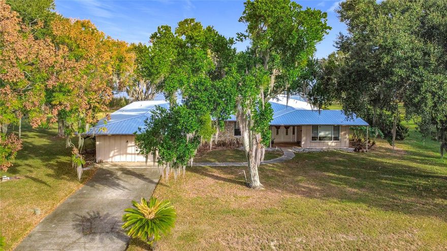 Unique and charming lakefront home offering just over 3,500 sq. ft. of living space, featuring large, spacious rooms throughout, beautiful wood floors, and a newer metal roof (2022). Enjoy a refreshing pool and an expansive 15' x 42' Florida room, all situated on just over an acre of serene, picturesque property. Inside, the spacious kitchen boasts solid wood cabinets, providing the perfect foundation for your personal updates and design vision. This home is truly ready to be brought back to its glory days, full of character, potential, and timeless charm. Located on Lake Lucy, this home is part of a vibrant and scenic Chain of Lakes in northern Clermont, including Lake Lucy, Lake Emma, Cherry Lake, and the Palatlakaha River Waterway. Ideal for fishing, boating, skiing, air boating, and endless outdoor exploration, this chain offers the ultimate Florida lakefront lifestyle. Great location too! Only 10–15 minutes to the FL Turnpike, 45 minutes to downtown Orlando and the theme parks, and just 20 minutes to Historic Downtown Clermont, known for its charming historic homes, unique shops, restaurants, breweries, and lively nightlife. You're also only 20 minutes south of The Villages, offering even more conveniences and entertainment options. Are you ready to embrace the lakefront lifestyle in this one-of-a-kind home? Start your adventures by building your own boat dock and enjoy everything this beautiful setting has to offer!