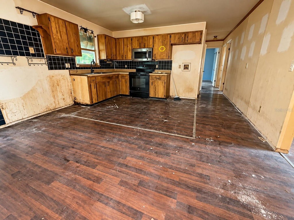 Photo of 1825 Huggins Drive, Apopka, FL 32703 (MLS # O6446806)