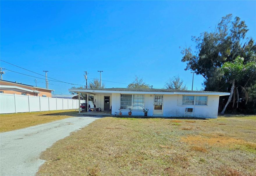 Prime investment or first-time homebuyer opportunity in an excellent Bradenton location! This 2-bedroom, 1-bath home sits on a large lot offering expansion or development potential. Centrally located near shopping, dining, and major conveniences, this property is ideal for investors or future homeowners looking to add value.

The home features new electrical and plumbing systems, along with a newly updated kitchen and bathroom. Ceramic tile flooring and ceiling fans are featured throughout. The galley kitchen opens to a bonus room, providing flexible living space. Two spacious bedrooms allow ample closet storage, and the bathroom includes a tub/shower combination with sliding glass doors.

A large carport includes a separate washer and dryer area. With an extra lot that allows room to expand, add living space, or explore future development, this property offers excellent long-term potential.

Tenant occupied — appointment only.