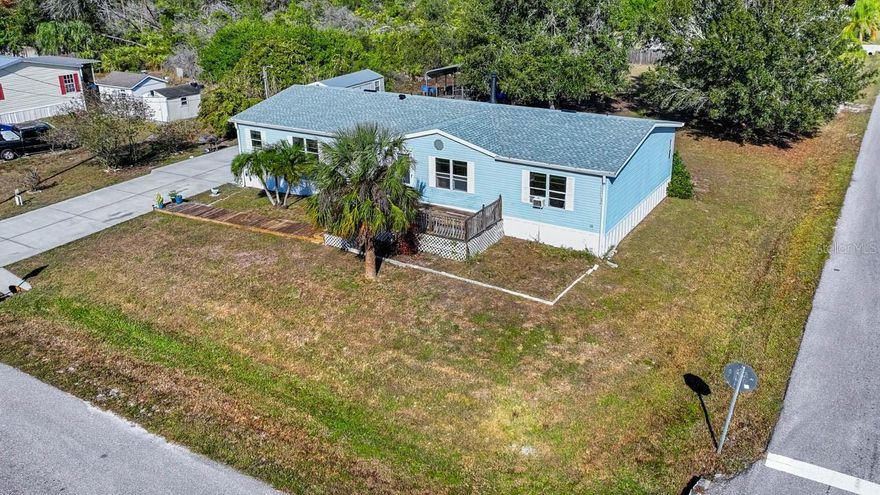 Seize the opportunity to own a spacious manufactured home situated on nearly half an acre in a peaceful Ruskin neighborhood with no HOA or CDD fees. Even better, the property is in Flood Zone X. This three-bedroom, two-bath home features a thoughtfully designed layout with ample living space, including a cozy family room complete with a wood-burning fireplace. The open kitchen provides plenty of cabinetry and counter space, ideal for everyday use and entertaining. The primary suite includes a private en-suite bathroom and an oversized walk-in closet with abundant storage. Two additional bedrooms provide additional flexibility with a full bathroom conveniently located between them. The expansive outdoor area presents endless opportunities, with space for gardens, play areas, pets, boats or recreational vehicles. A large parking area and a covered carport behind the home provide excellent storage options for boats, equipment, or workshop needs. Conveniently located near shopping, dining, US-41, I-75, and Tampa Bay’s waterfront attractions, this property combines the charm of country living with easy access to modern amenities.